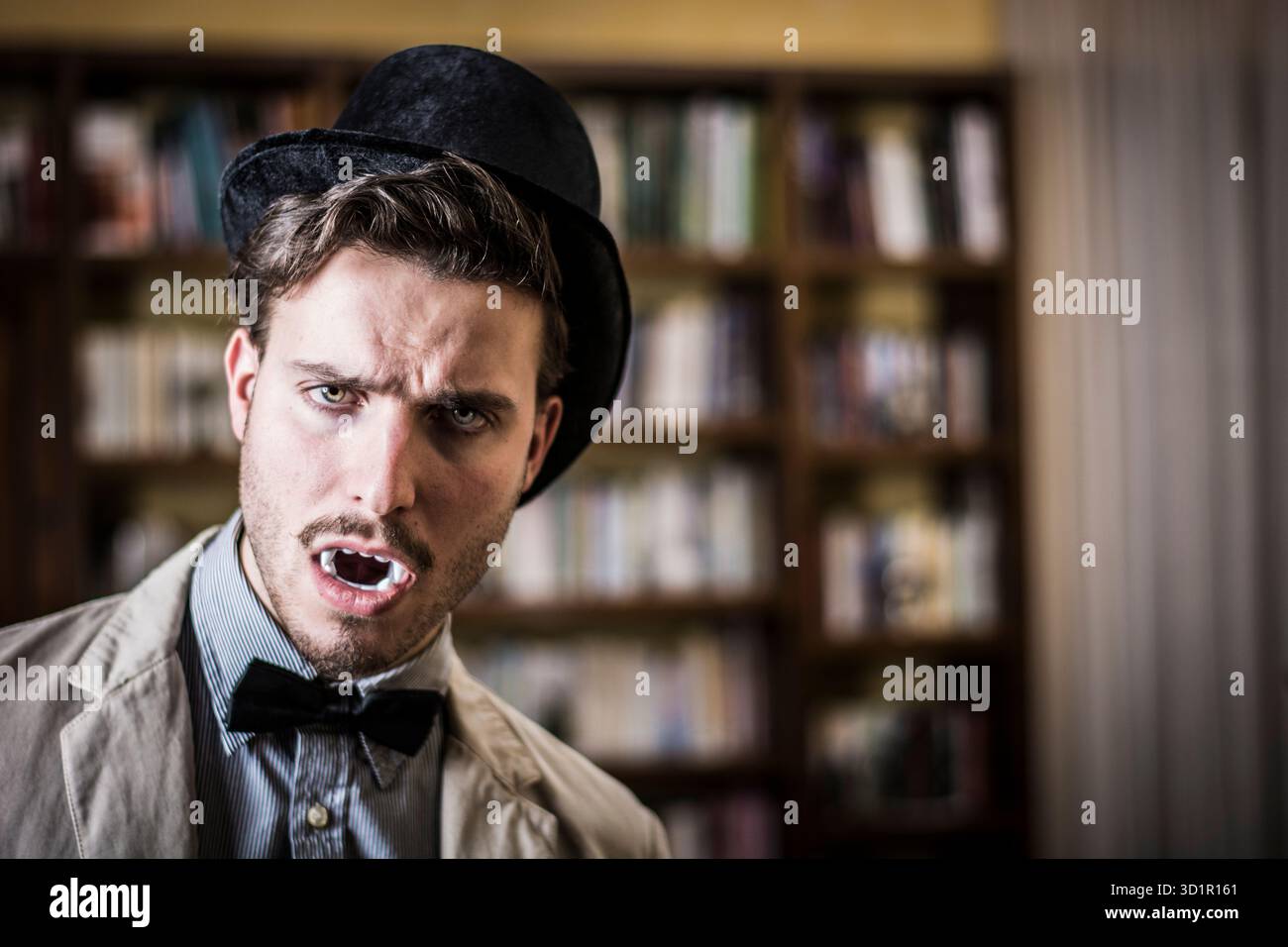 Close up Young Handsome White Vampire with Black Top Hat Stock Photo