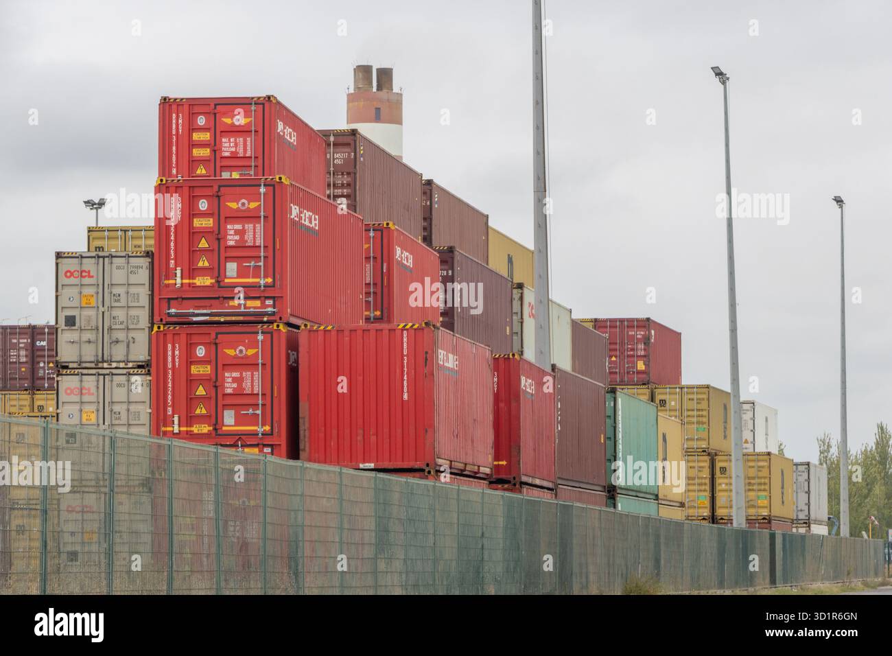 Intermodal containers stacked high, representing global logistics and ...