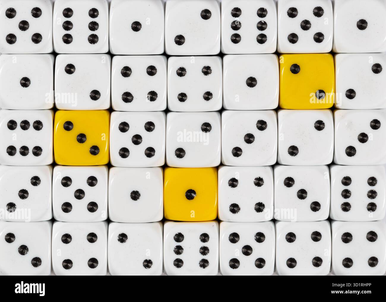 Background of random ordered white dices with three yellow cubes Stock Photo