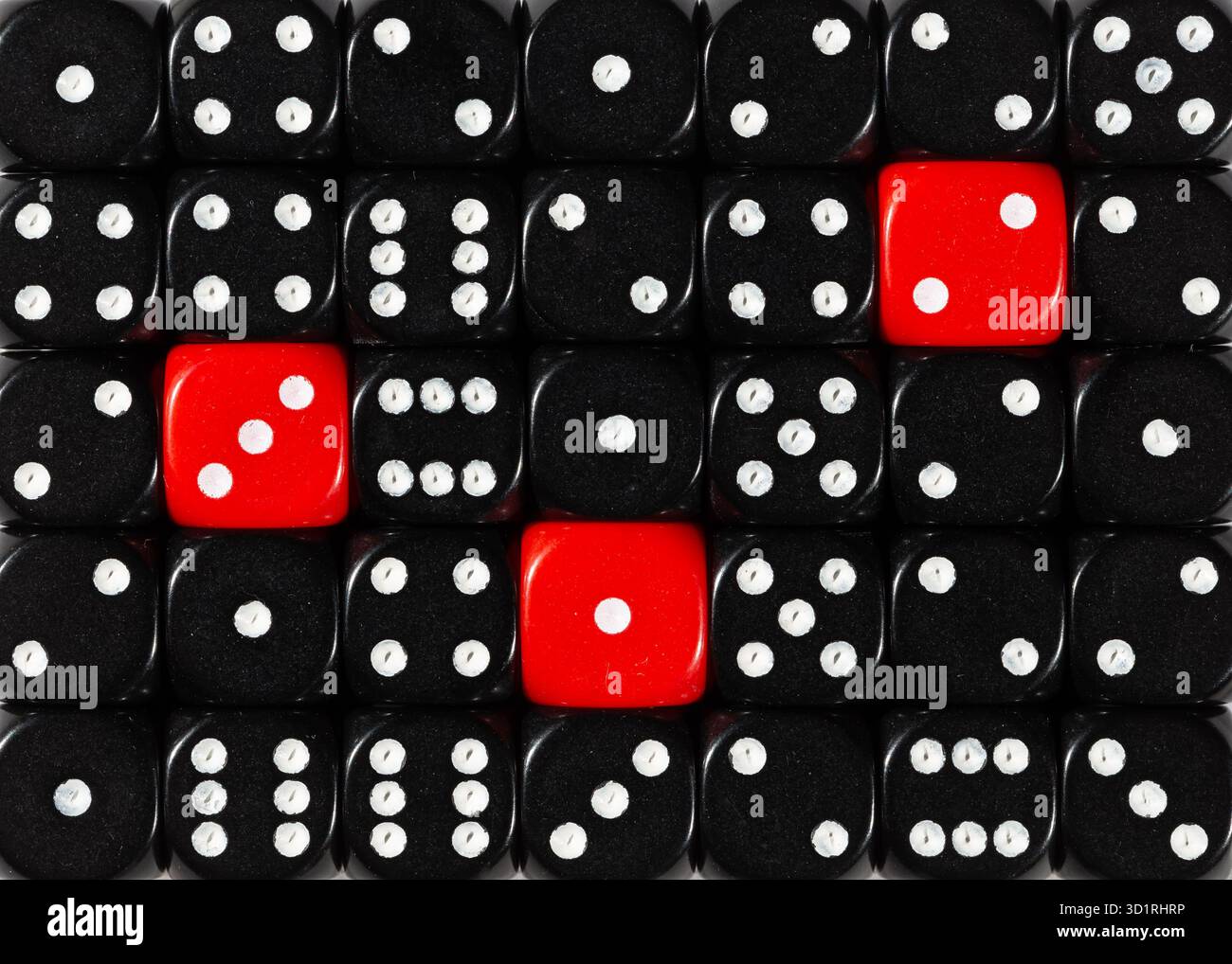 Background of random ordered black dices with three red cubes Stock Photo