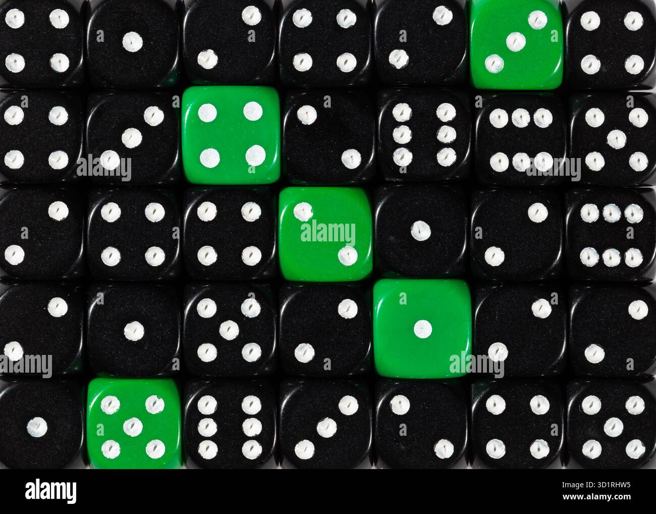 Background of random ordered black dices with five green cubes Stock Photo