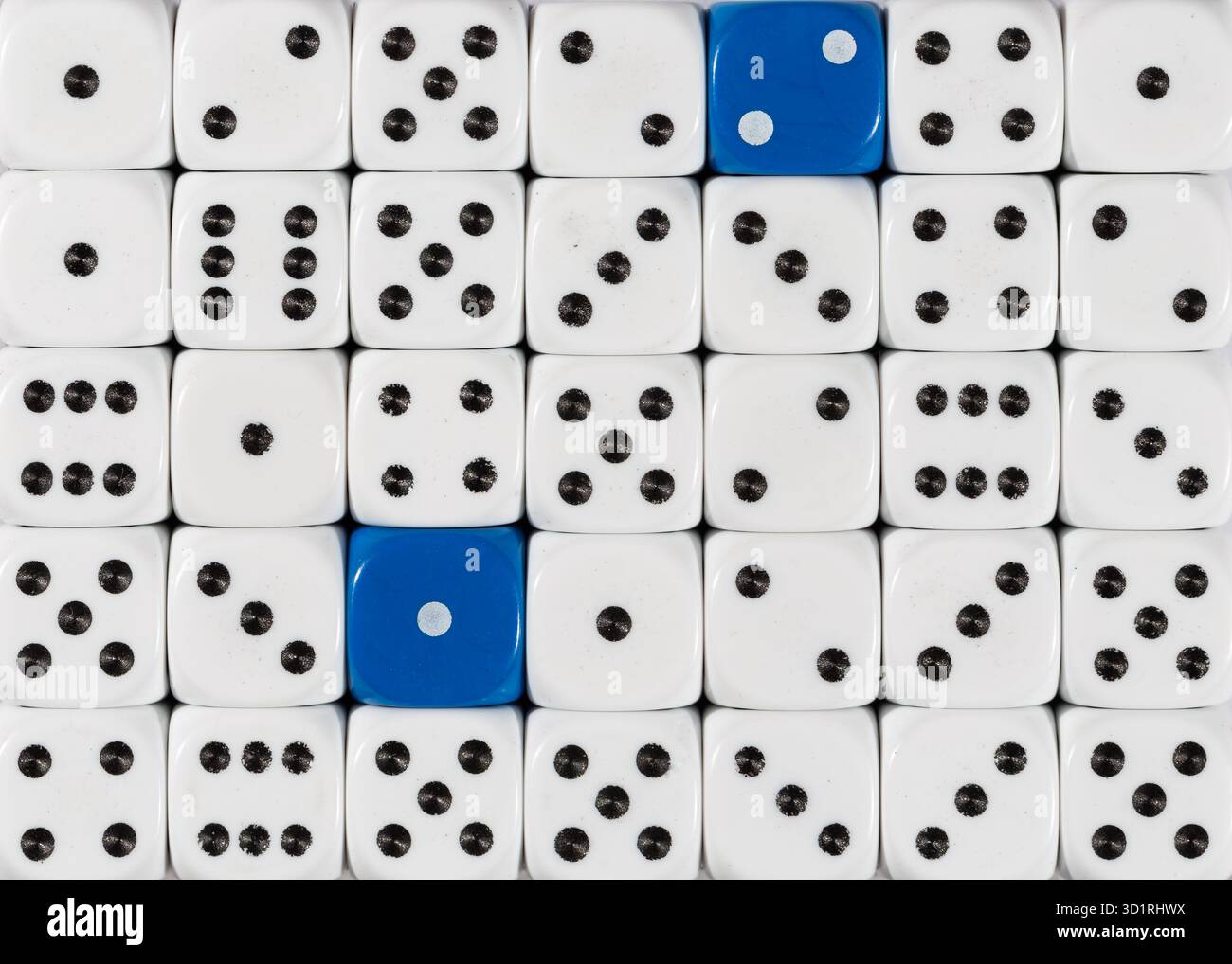 Background of random ordered white dices with two blue cubes Stock Photo