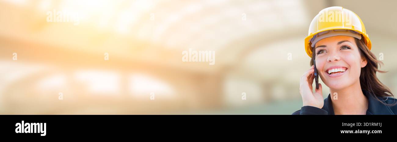 Banner With Female Contractor In Hard Hat Using Cell Phone Stock Photo
