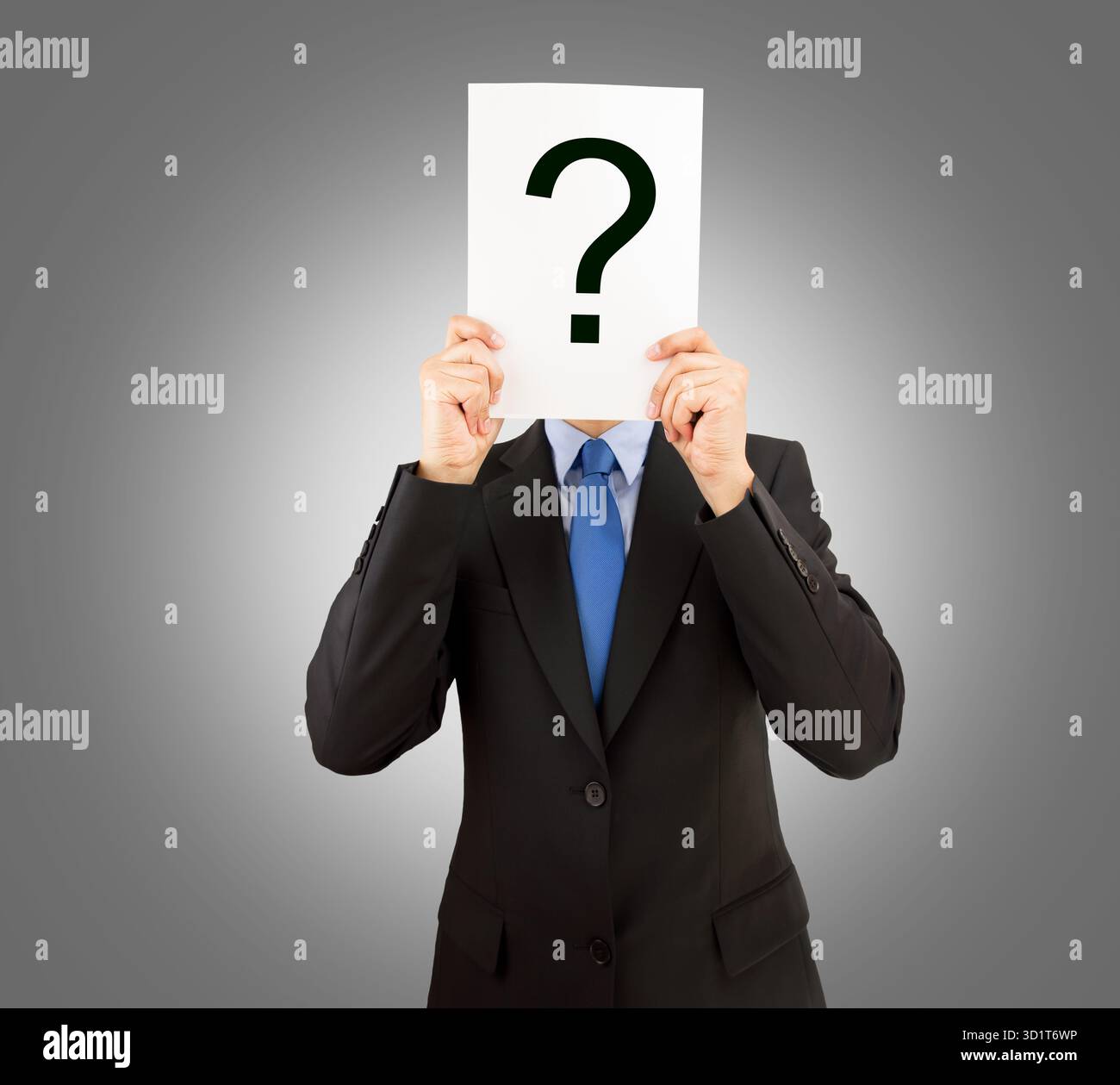 businessman holding a question mark sign in front of his face Stock ...
