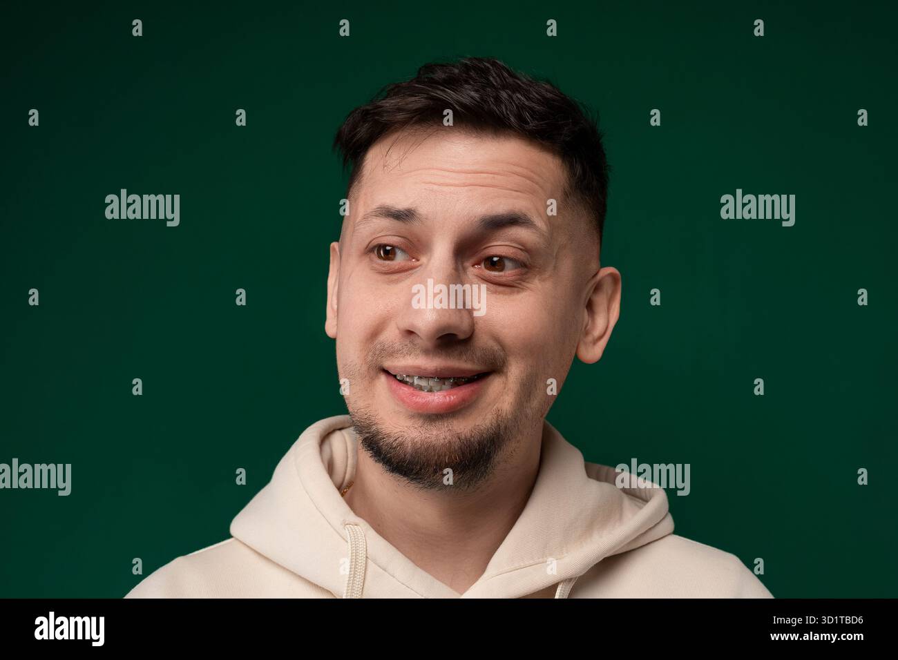 Smiling Man in White Hoodie Stock Photo