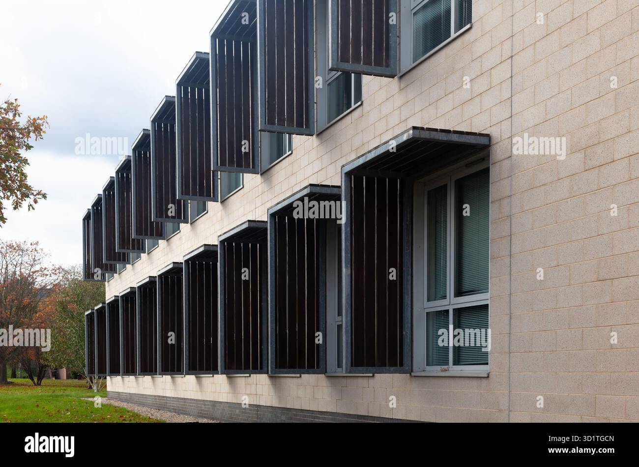 External sun light protection around windows on a concrete block constructed building, UK. Stock Photo
