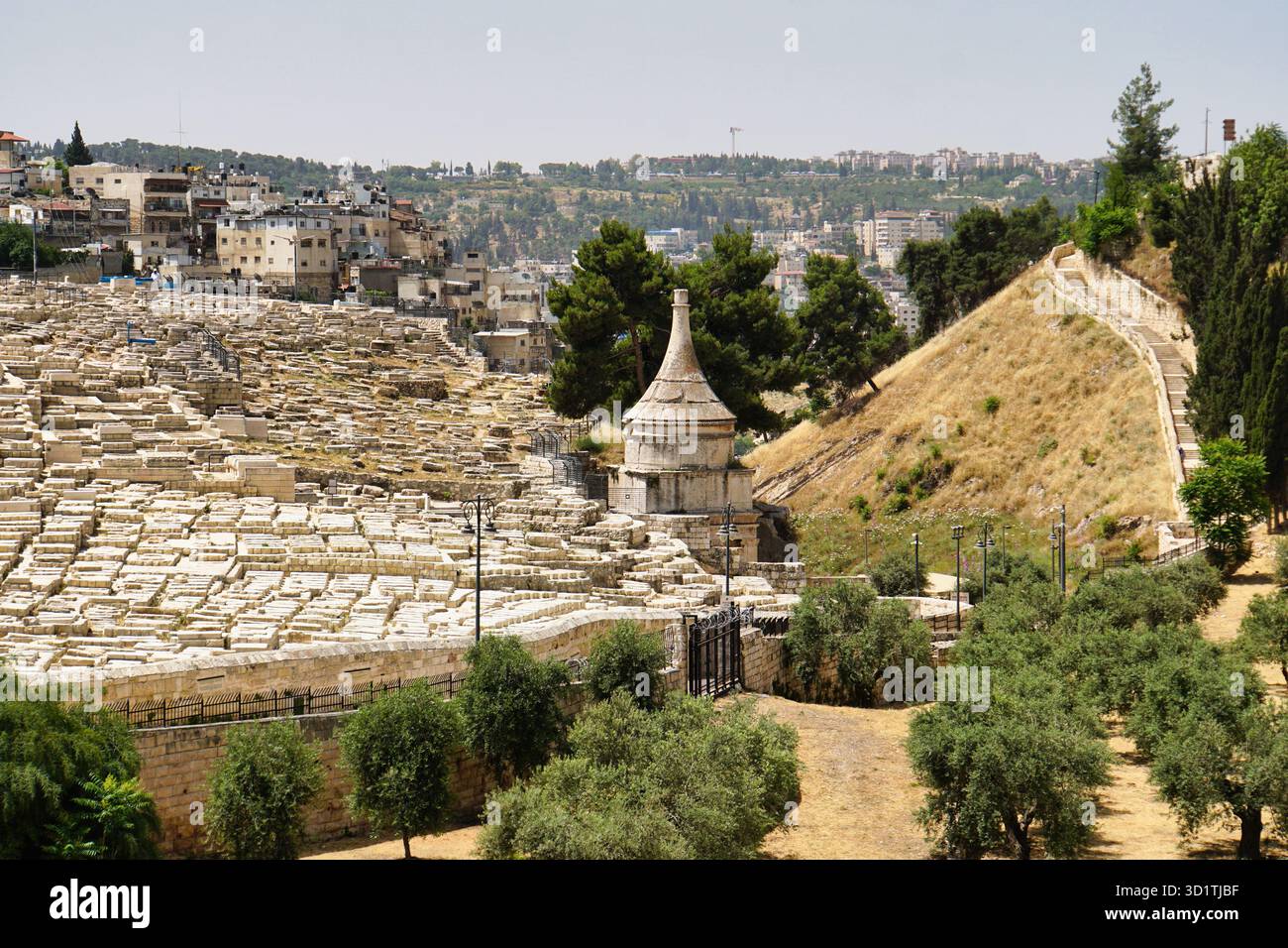 Tomb of Absalom in the Kidron Valley in Jerusalem with Jewish cemetery Stock Photo