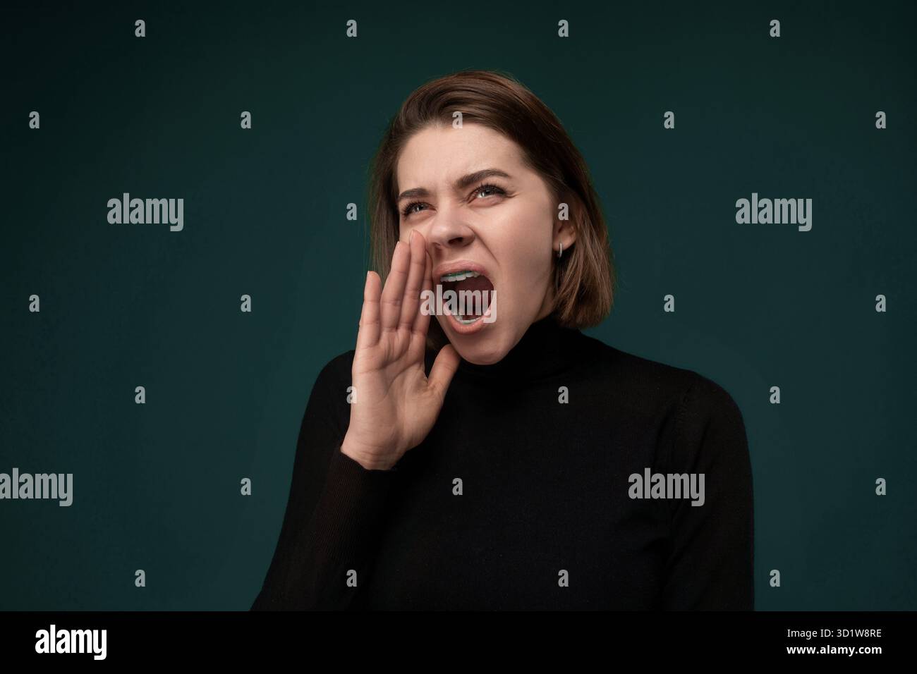 Woman Making Face With Mouth Open Stock Photo