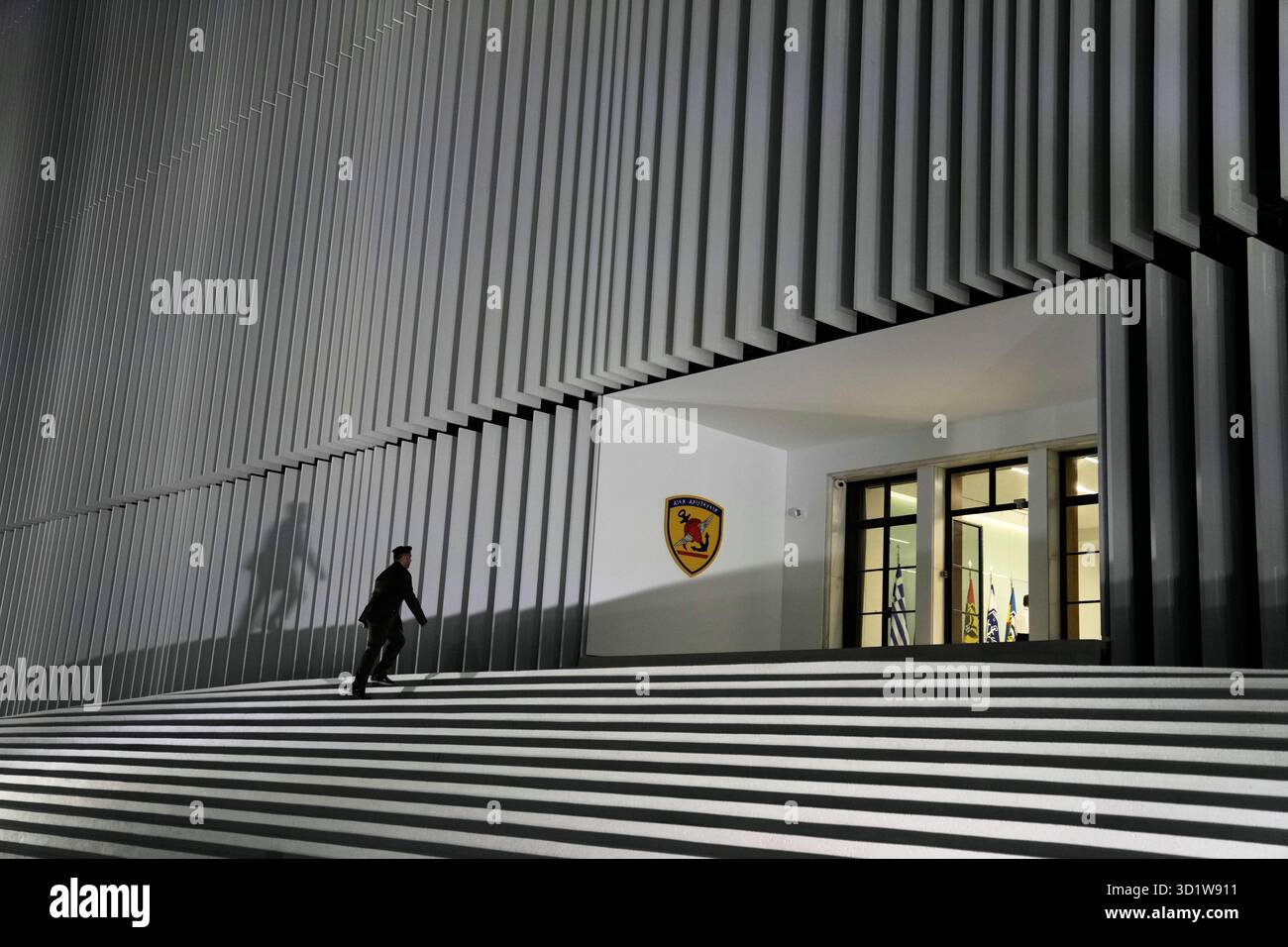 A military officer enters the Defense Ministry during the unveiling ...