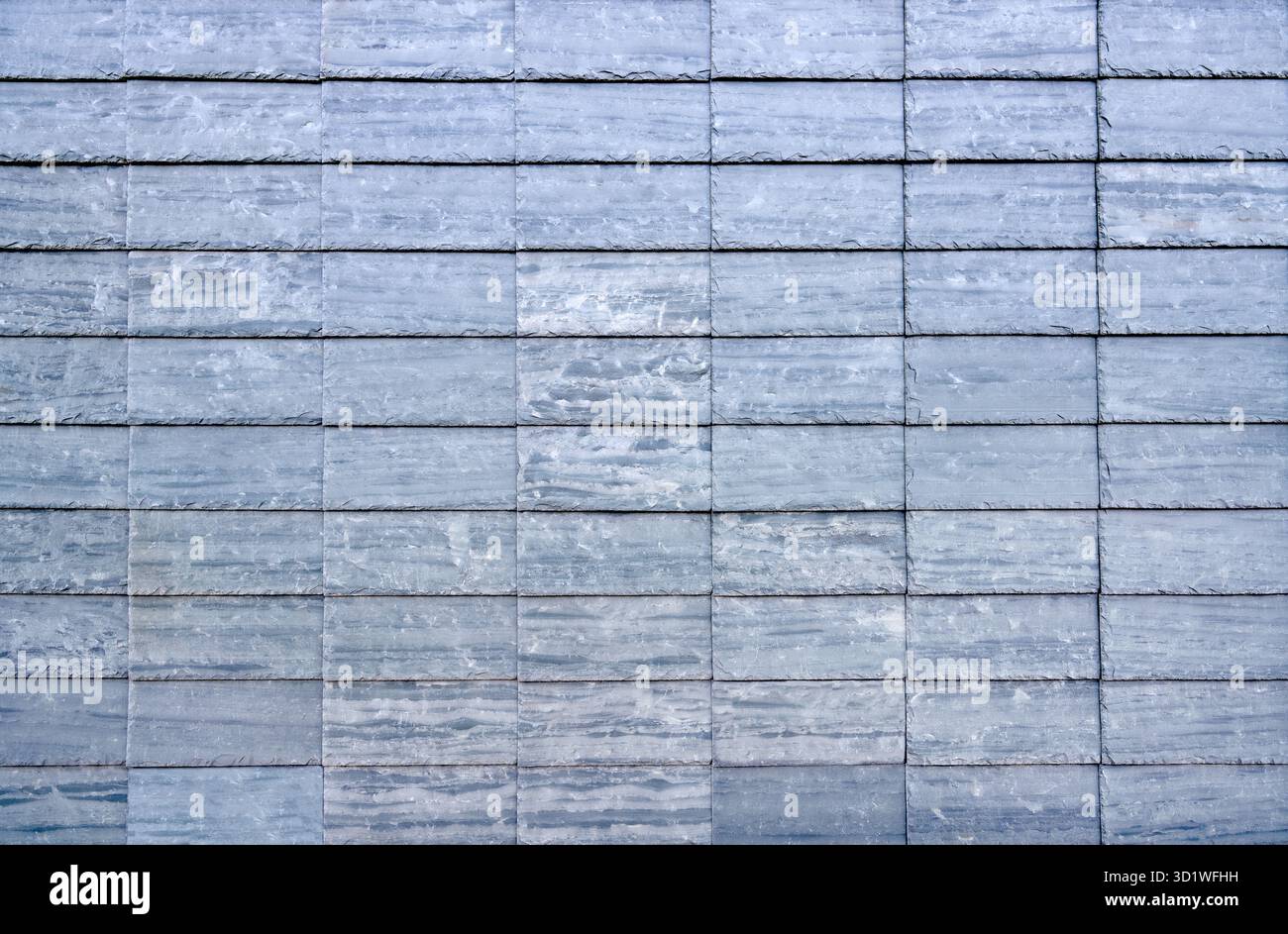 Blue grey rectangular slate plates as wall cladding Stock Photo