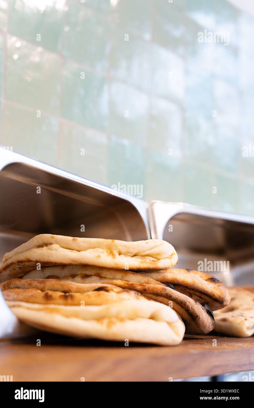 Fresh Naan Bread Stack in Restaurant Kitchen Stock Photo