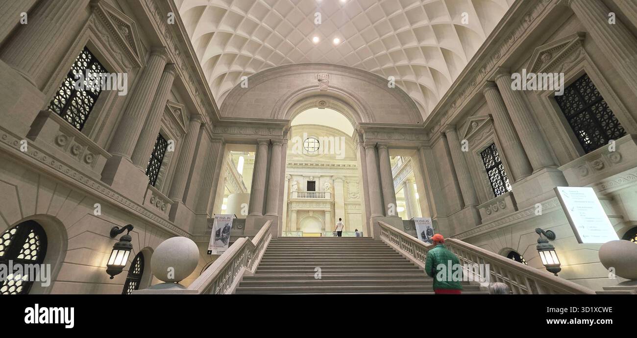 Berlin, Germany - June 02, 2025: Grand staircase leads to museum interior showcasing elegant architecture and soft lighting. - Smartphone Captured Stock Image