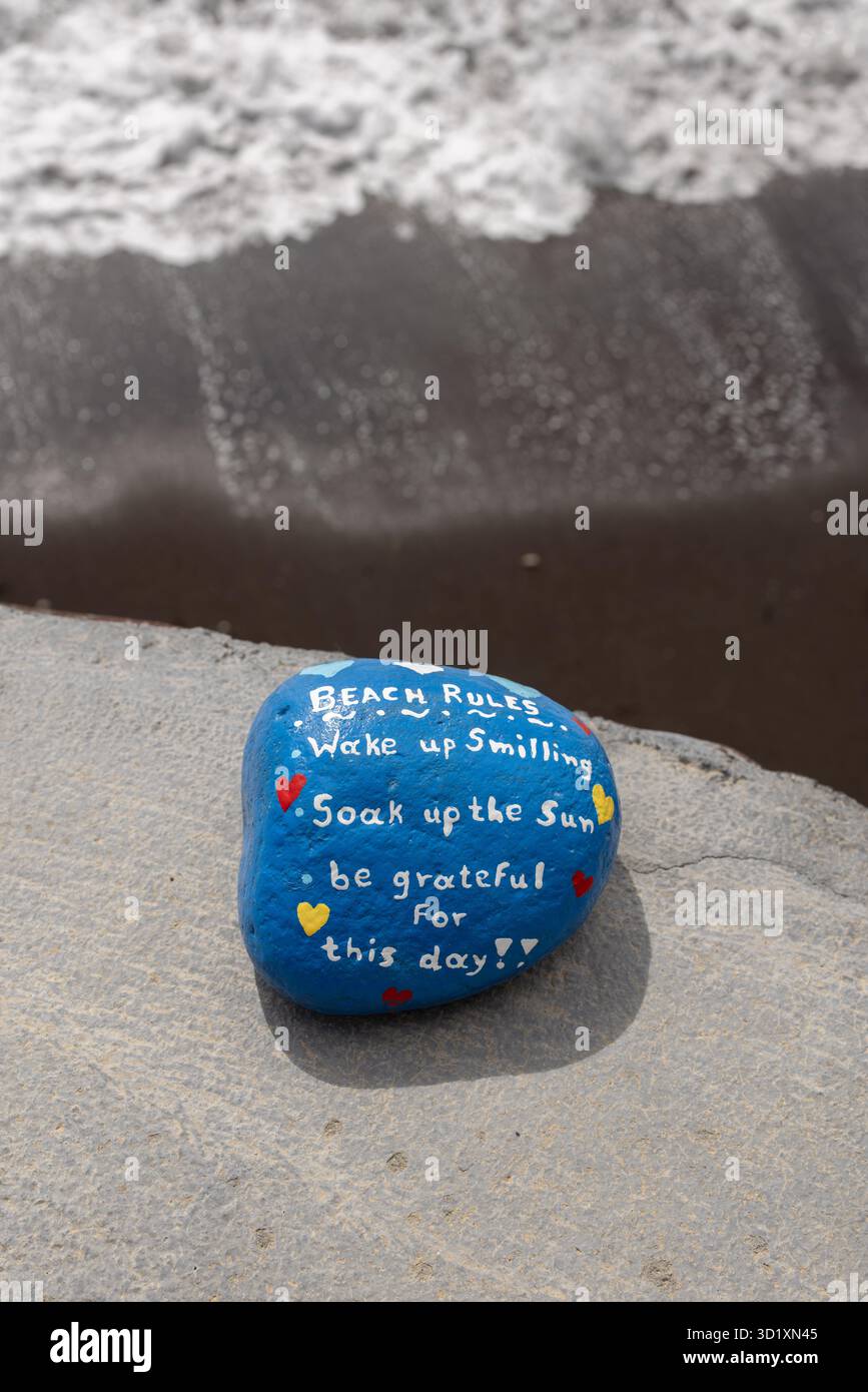 Inspirational painted rock with a positive beach rules message on the ...