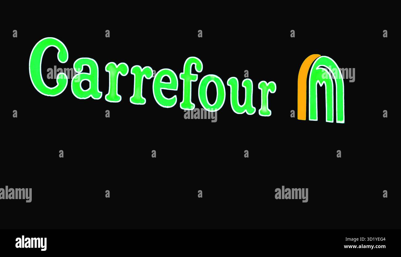 Carrefour City, european supermarket neon signage on facade at night ...
