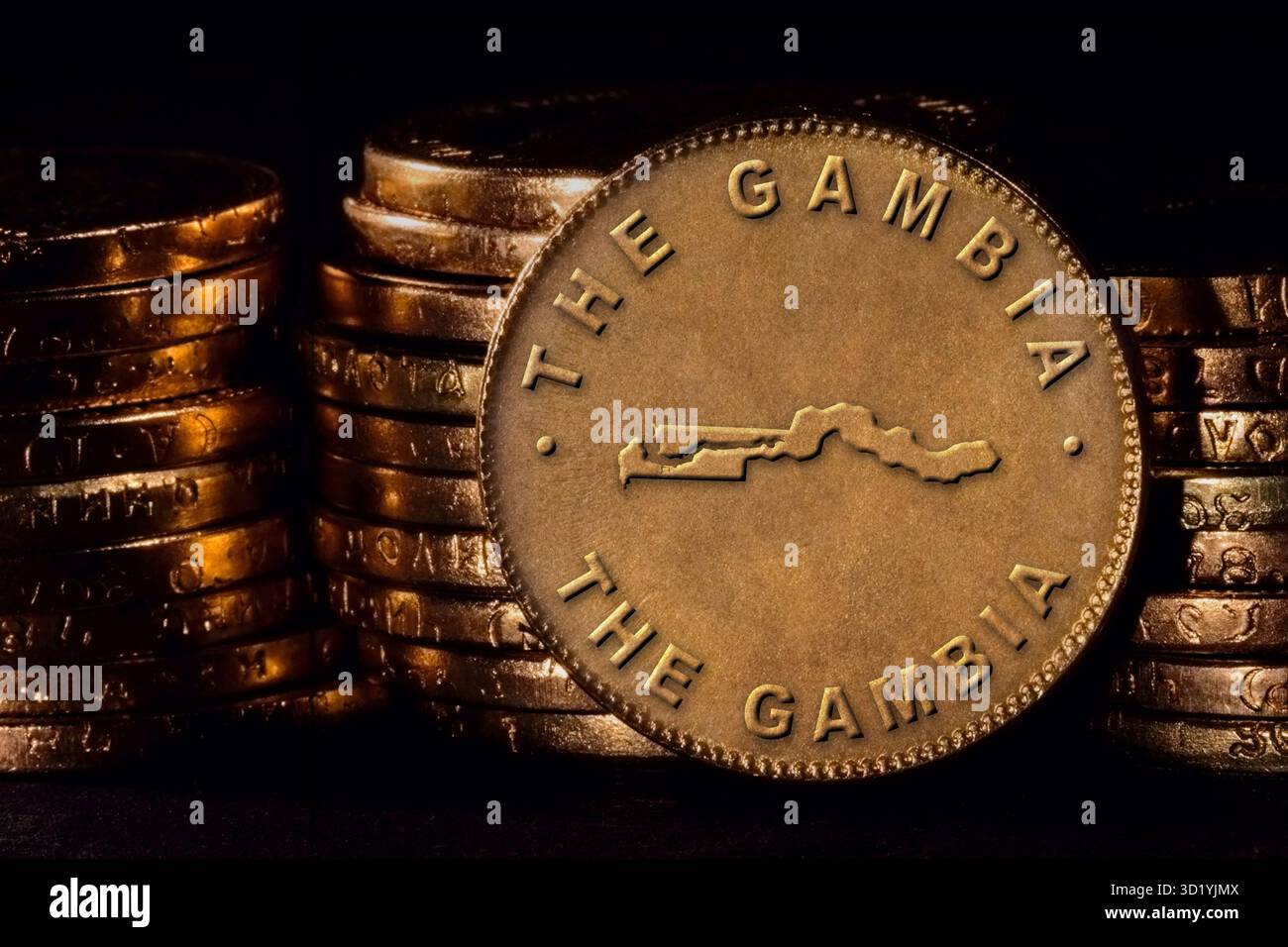 Golden Coin with Map of Gambia Stock Photo