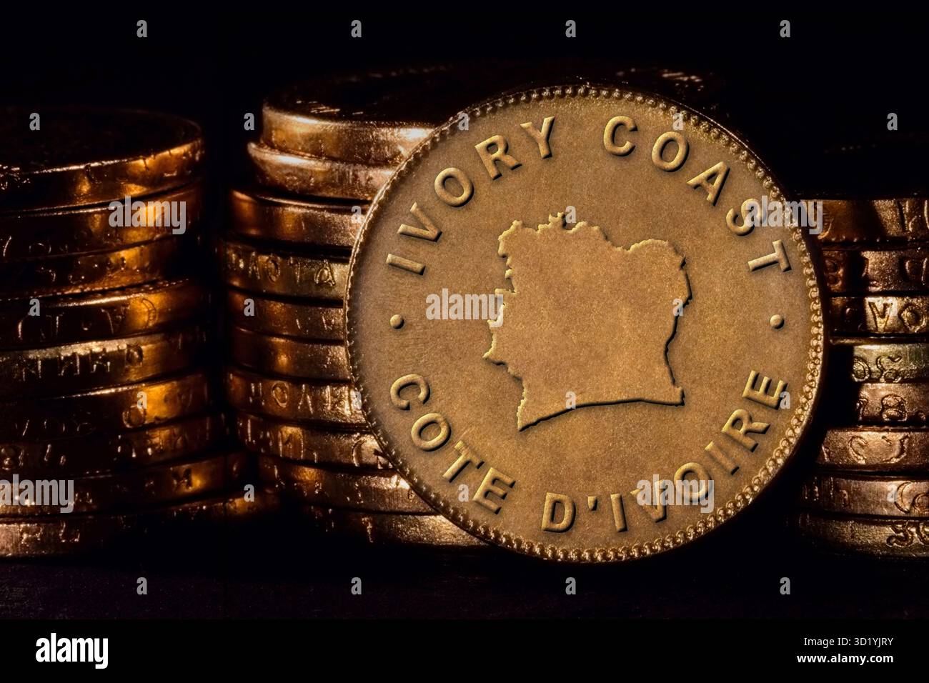Golden Coin with Map of Ivory Coast Stock Photo