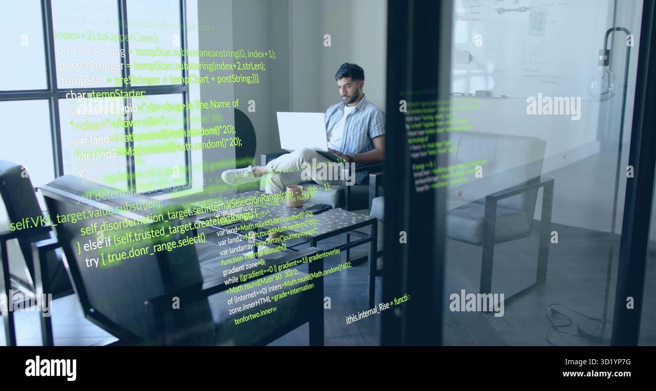 Working Indian software engineer coding on laptop on sofa in office lounge with code reflections Stock Photo