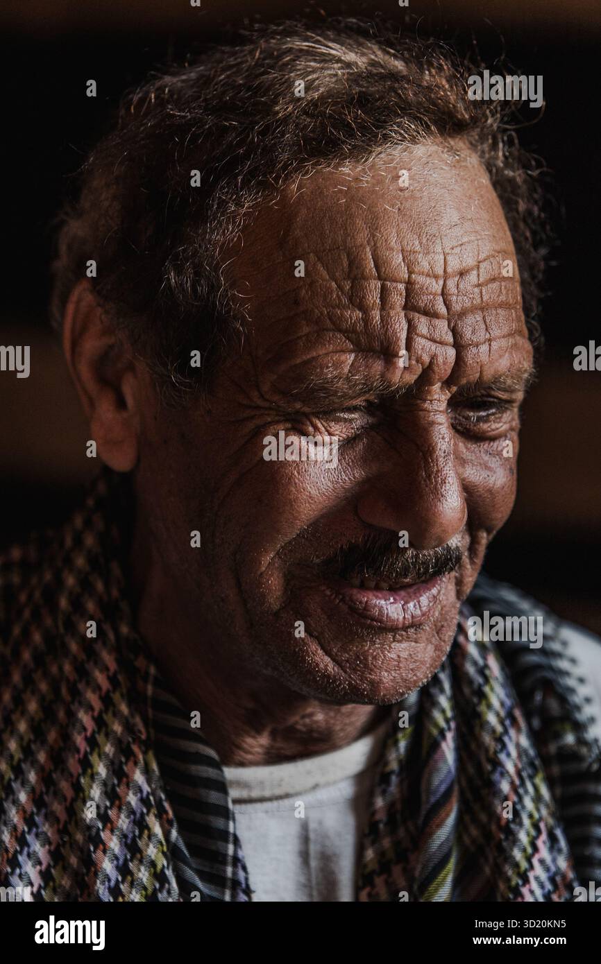 Bedouin musician performing alone on his rababa instrument inside a ...