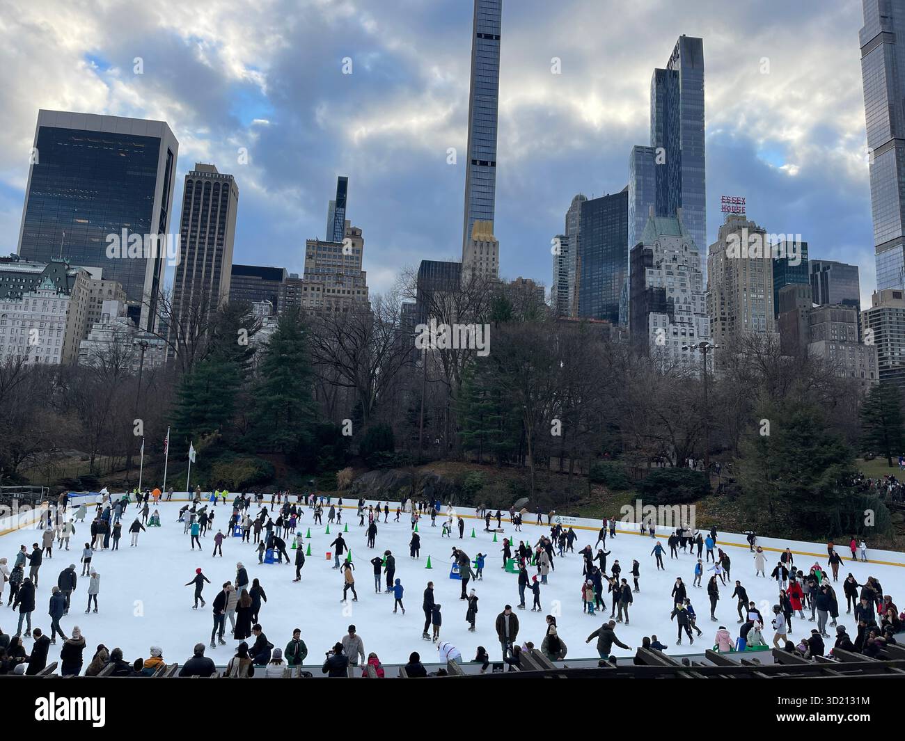Winter fun on the ice as people skate in Central Park. - Smartphone Captured Stock Image