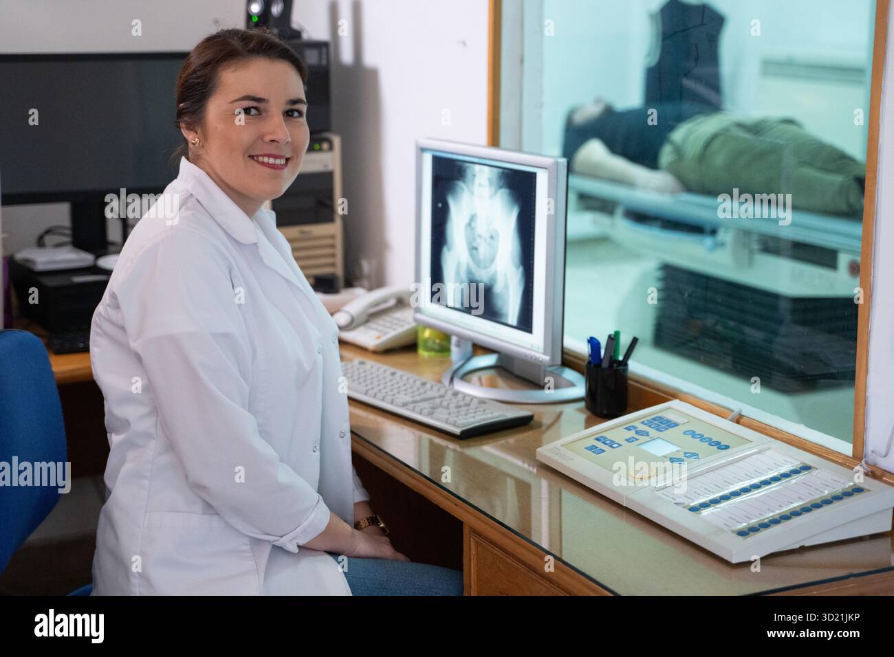 Radiologist Analyzing X-Ray Scans in a Medical Imaging Room Stock Photo