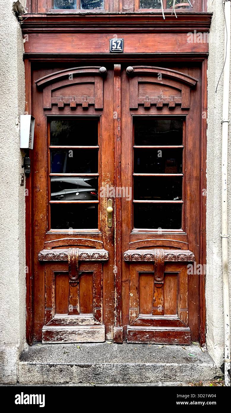 Brown front door residential building exterior in Sofia Bulgaria, Eastern Europe, Balkans, EU - Smartphone Captured Stock Image