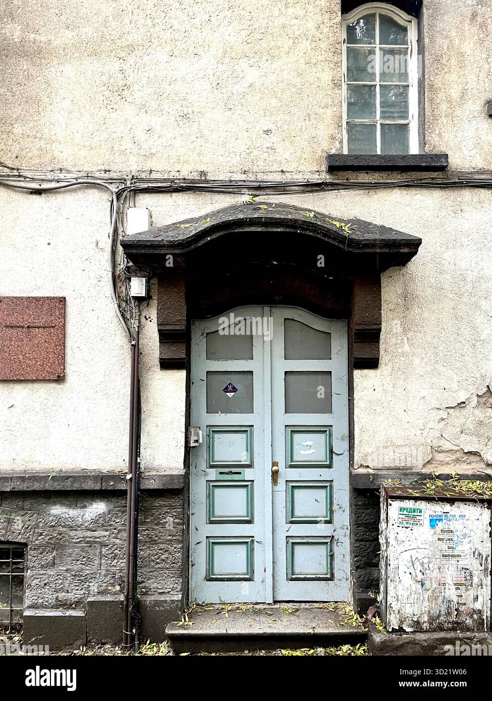 Residential building exterior grey front door in Sofia Bulgaria, Eastern Europe, Balkans, EUI - Smartphone Captured Stock Image