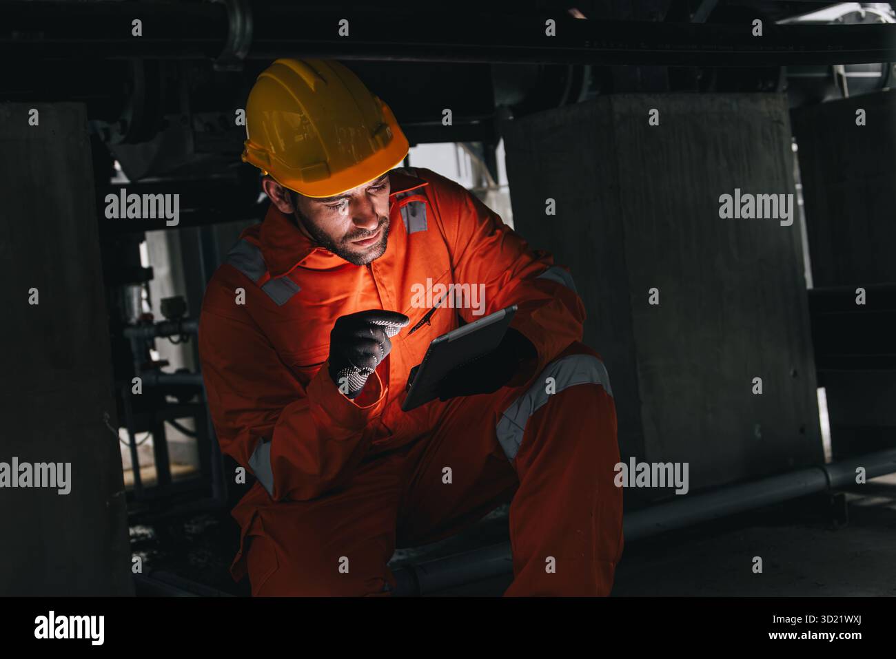 Professional engineer hispanic latin male service leakage check maintenance underground valve pipeline using tablet digital device technology Stock Photo