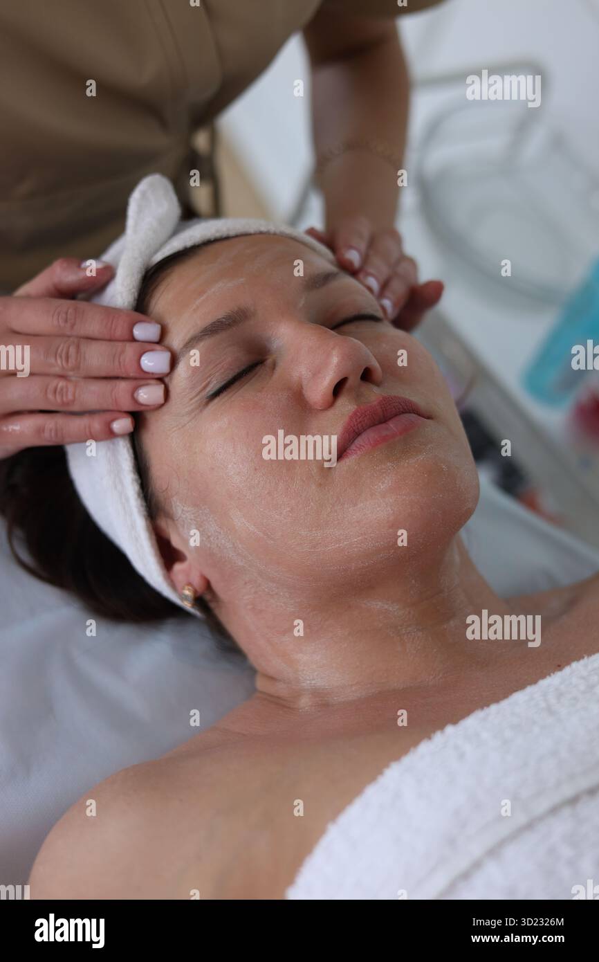 Relaxing facial massage procedure Stock Photo