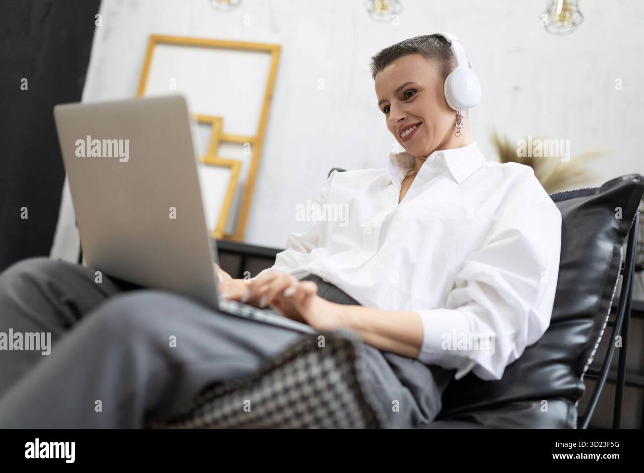 Successful female freelancer working from home in a cozy atmosphere Stock Photo