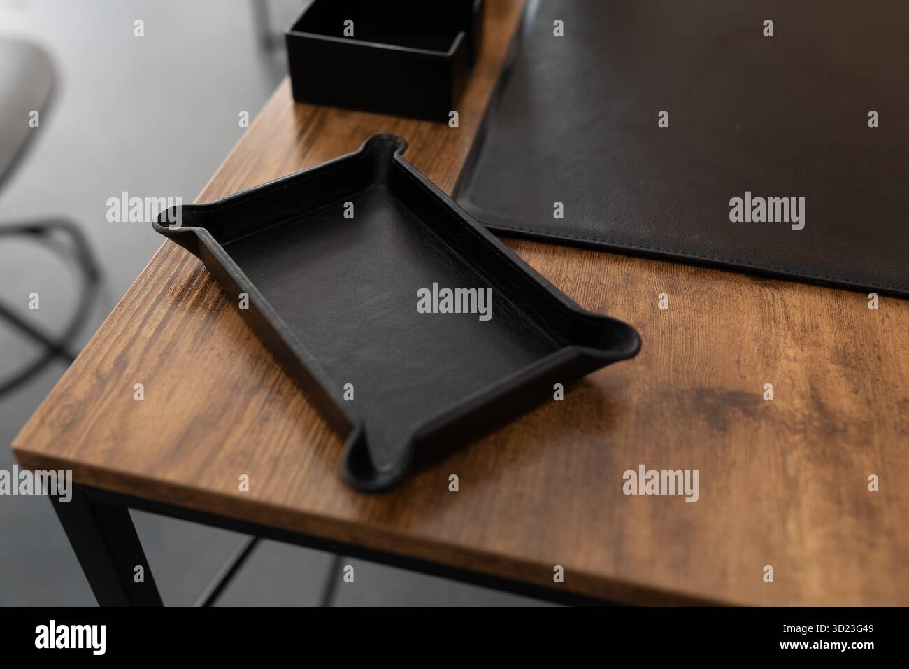 Accessory for stationery made of genuine leather on a working wooden table in the office Stock Photo