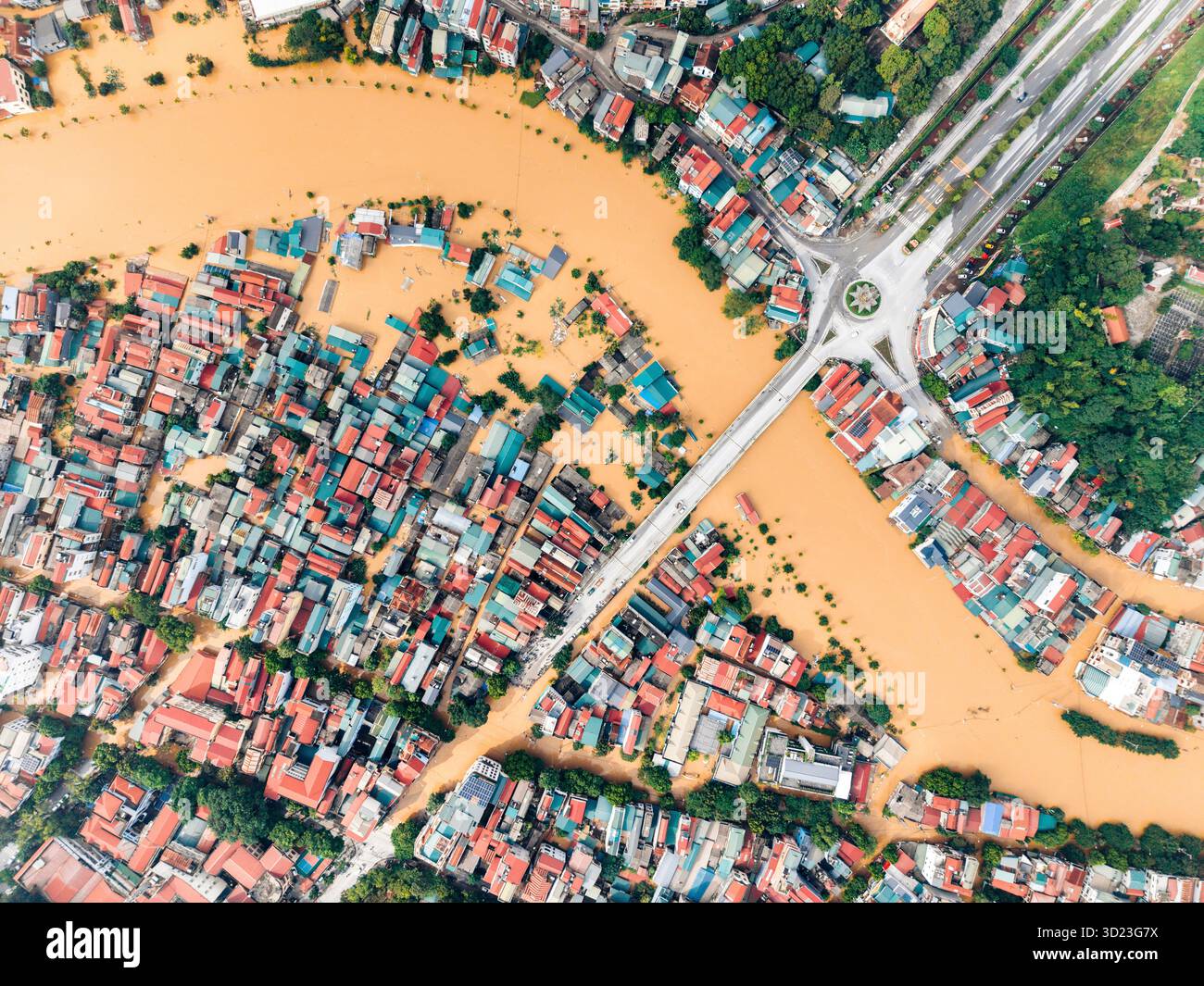 Aerial view of a flooded town with submerged roads and inundated ...