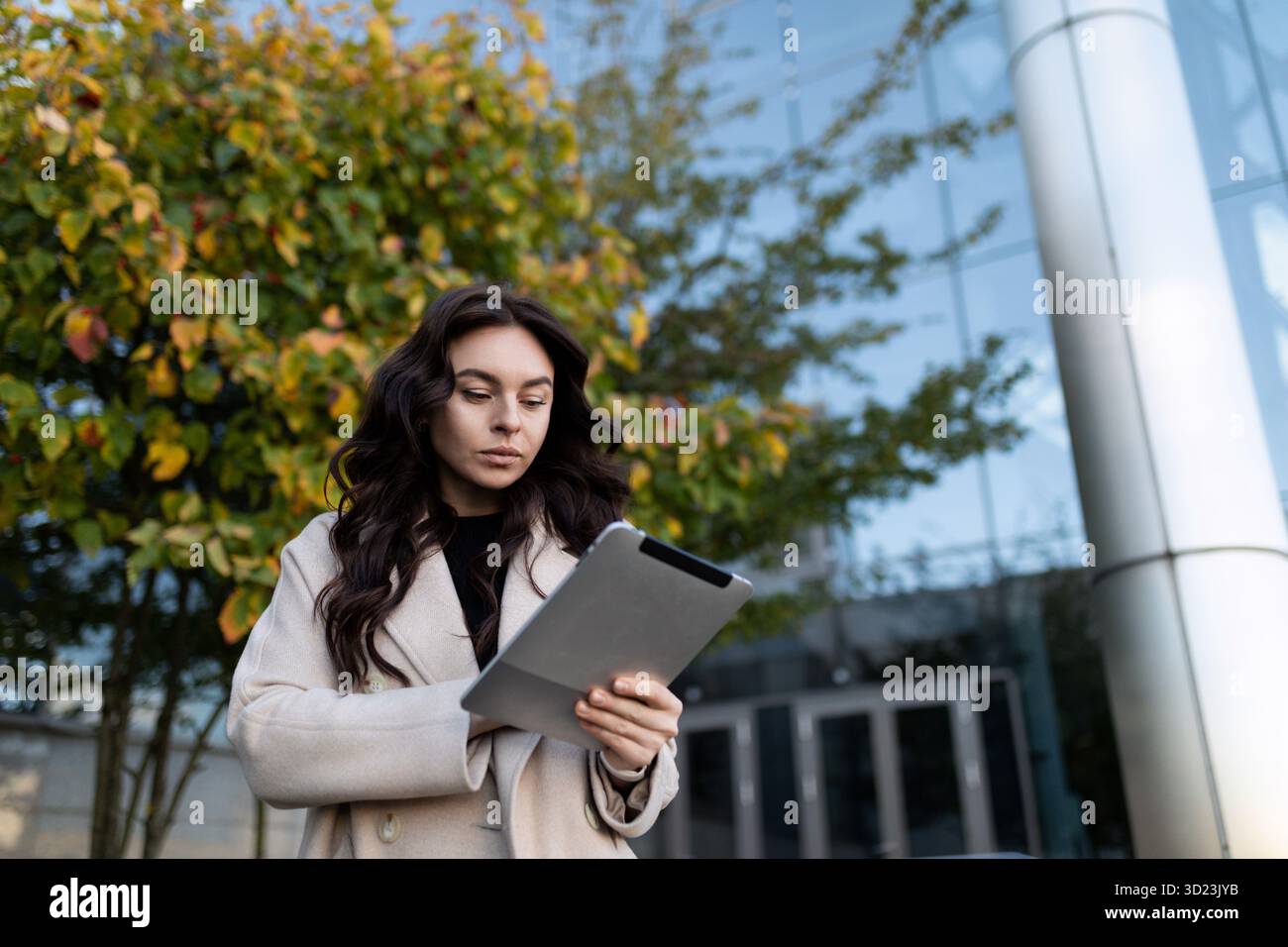 Highly successful businessman work remotely with tablet outside Stock Photo