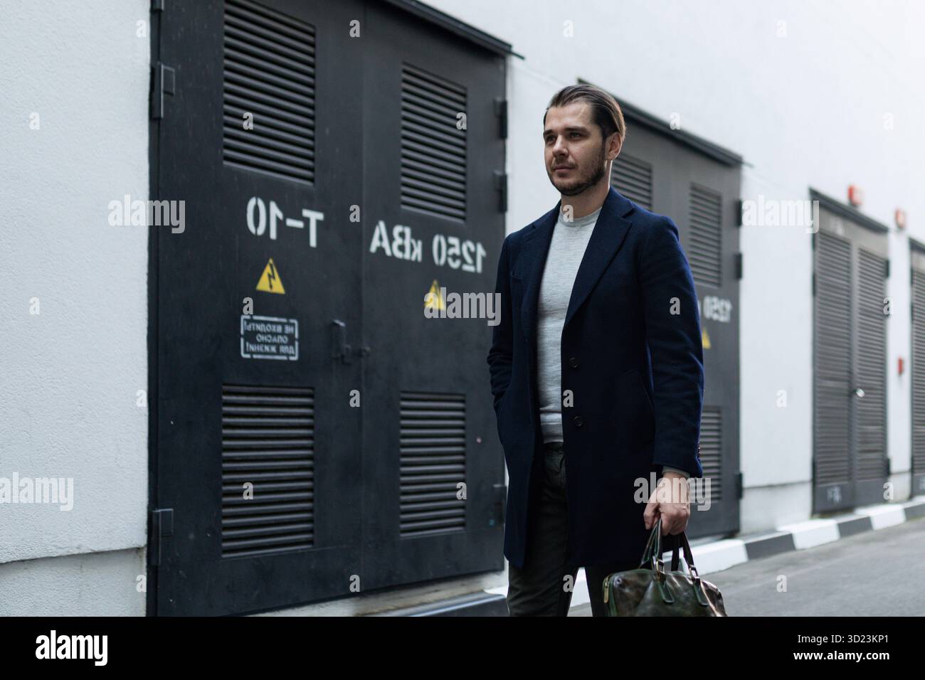 Business man adult caucasian engineer goes to work with a briefcase Stock Photo