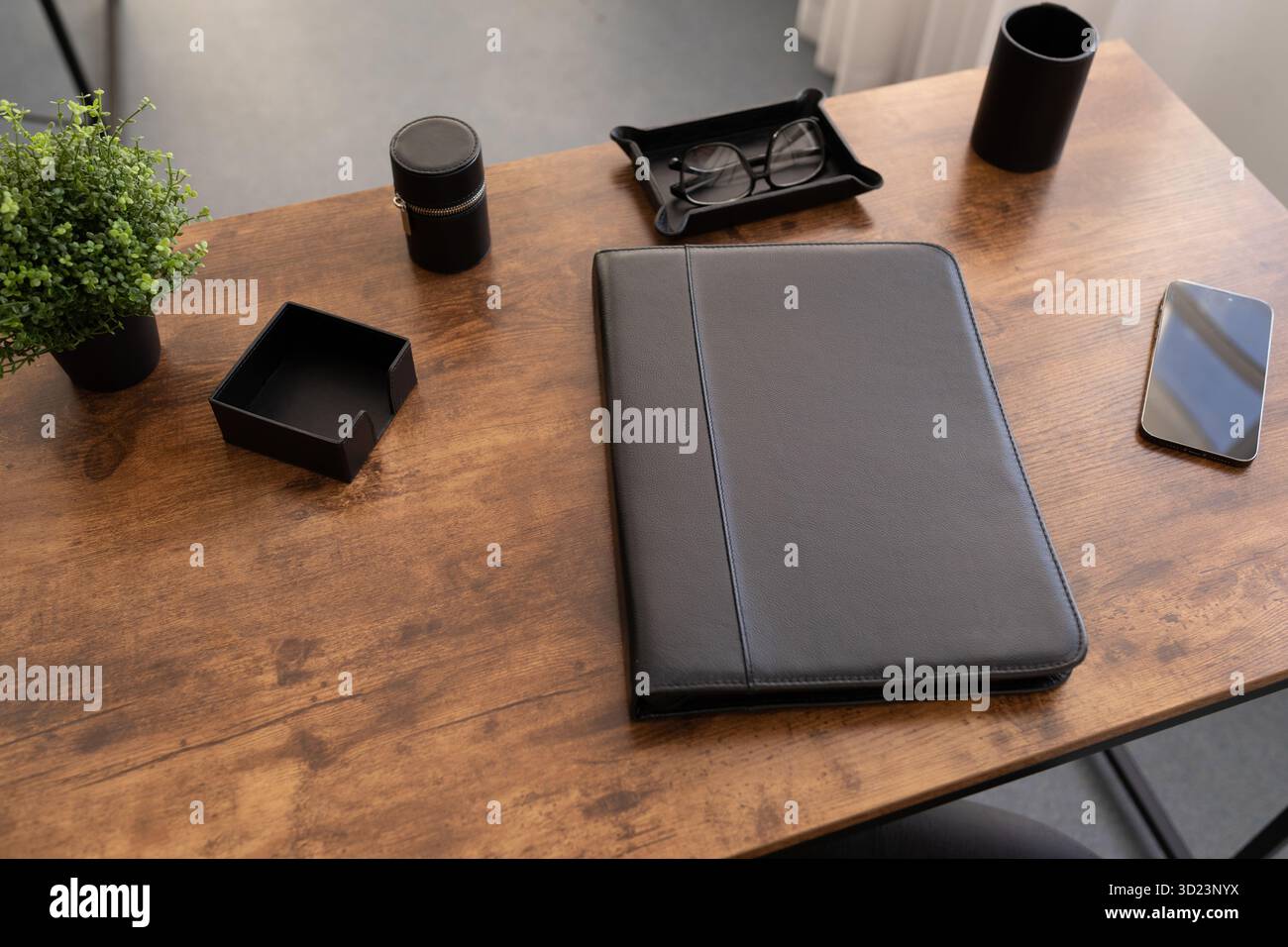 Leather folder for documents on the desktop in brown color Stock Photo