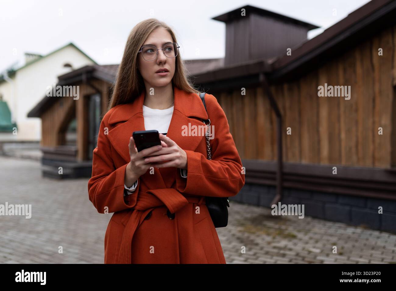 Business young caucasian woman with a smartphone in her hands Stock Photo