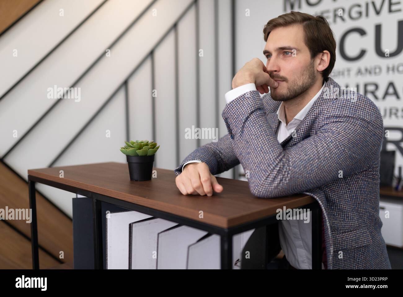 Portrait of a pensive businessman in a stylish office Stock Photo