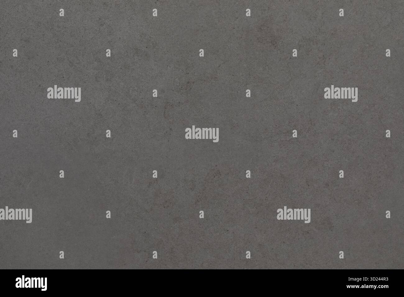 Gray concrete surface with subtle texture and patterns from different lighting conditions Stock Photo