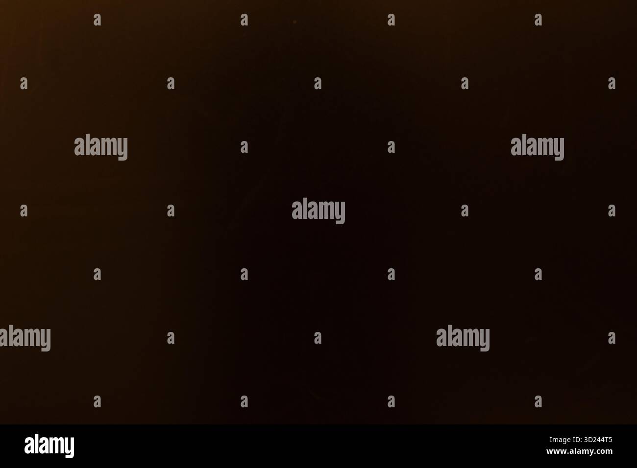 Dark background with subtle texture, hinting at depth and simplicity for artistic interpretation Stock Photo