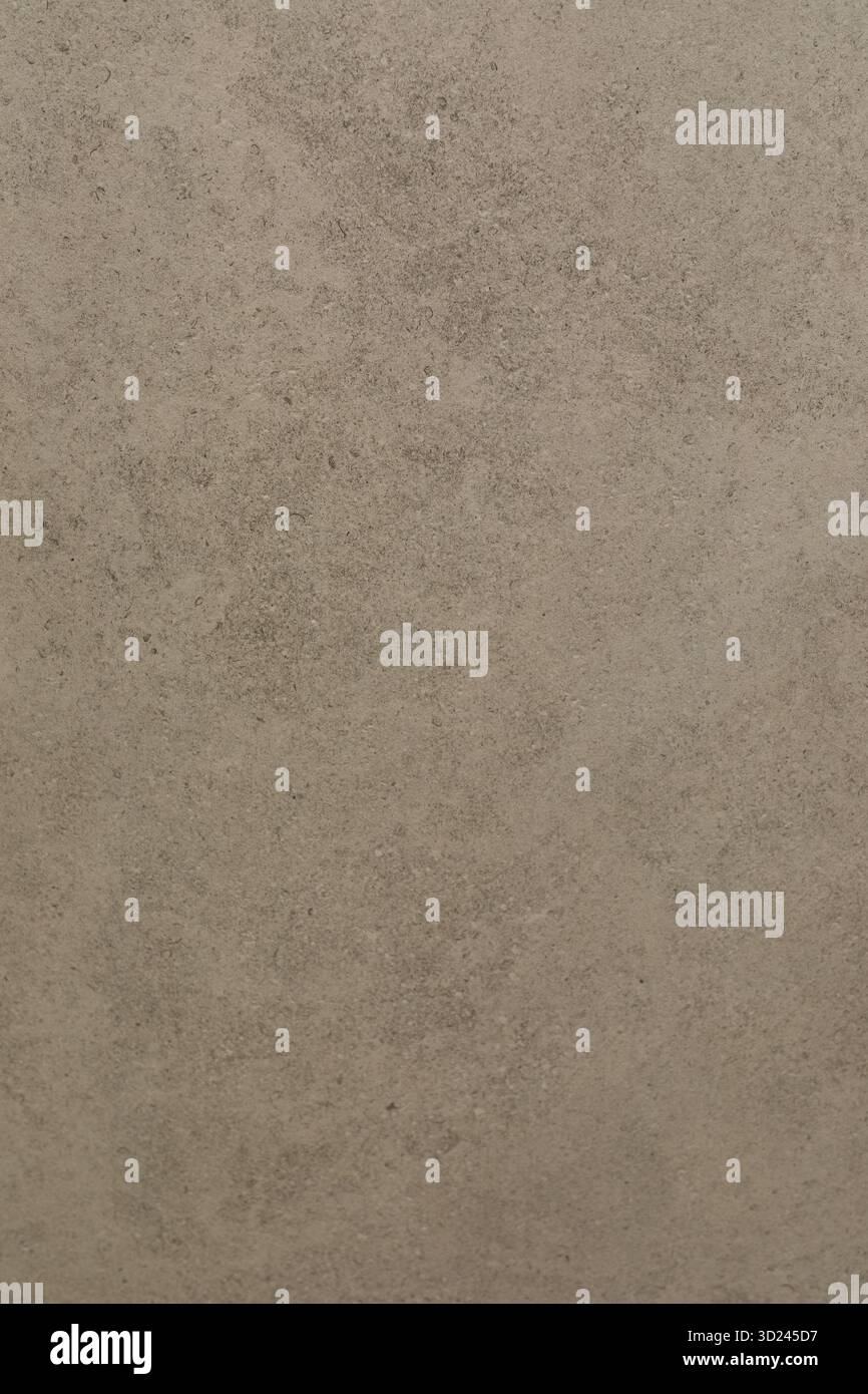 Surface texture of a natural stone with earthy colors showcasing detailed patterns and variations in a subtle design Stock Photo