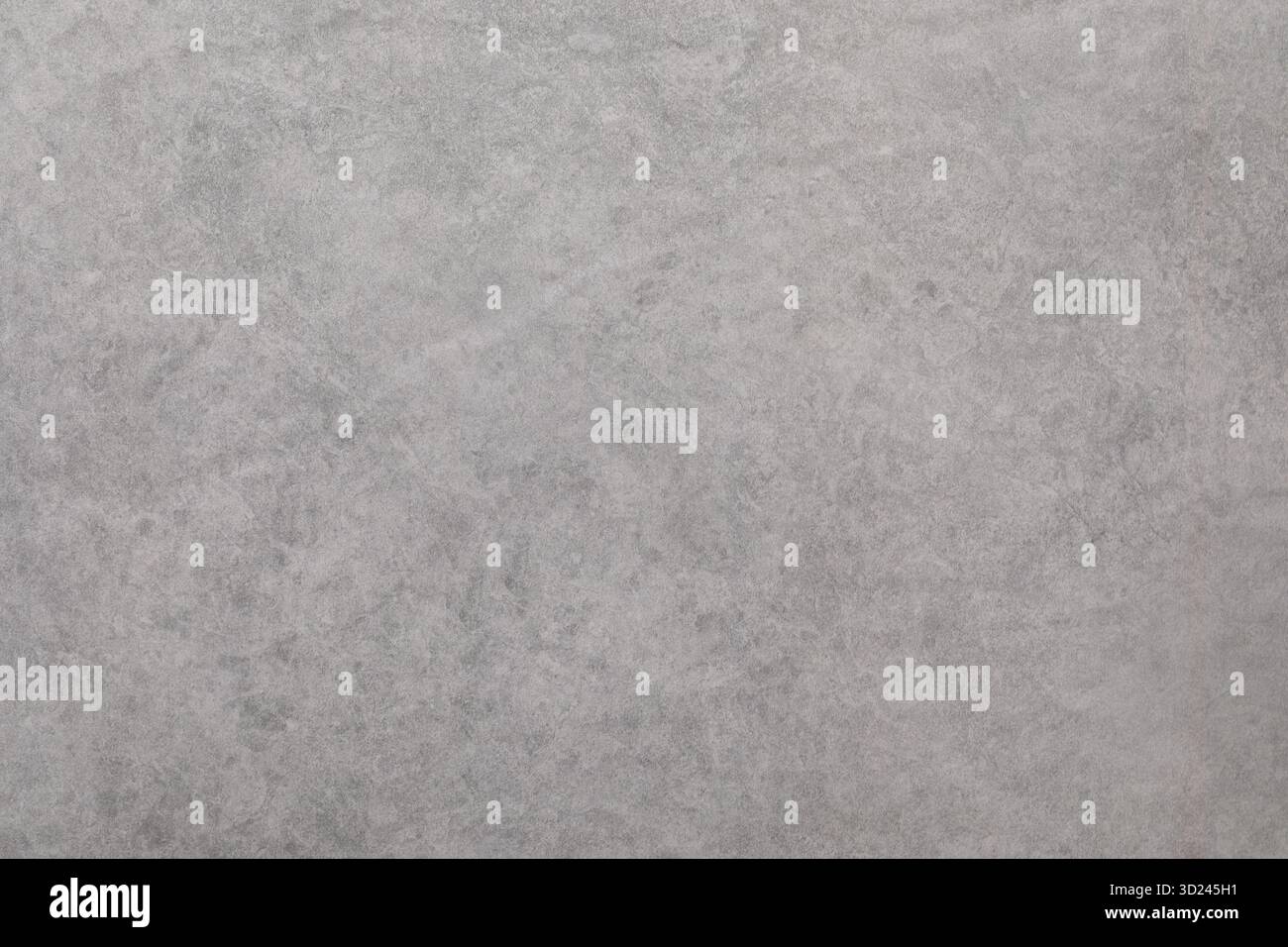 Textured gray surface with subtle patterns and tones ideal for backgrounds in various projects Stock Photo