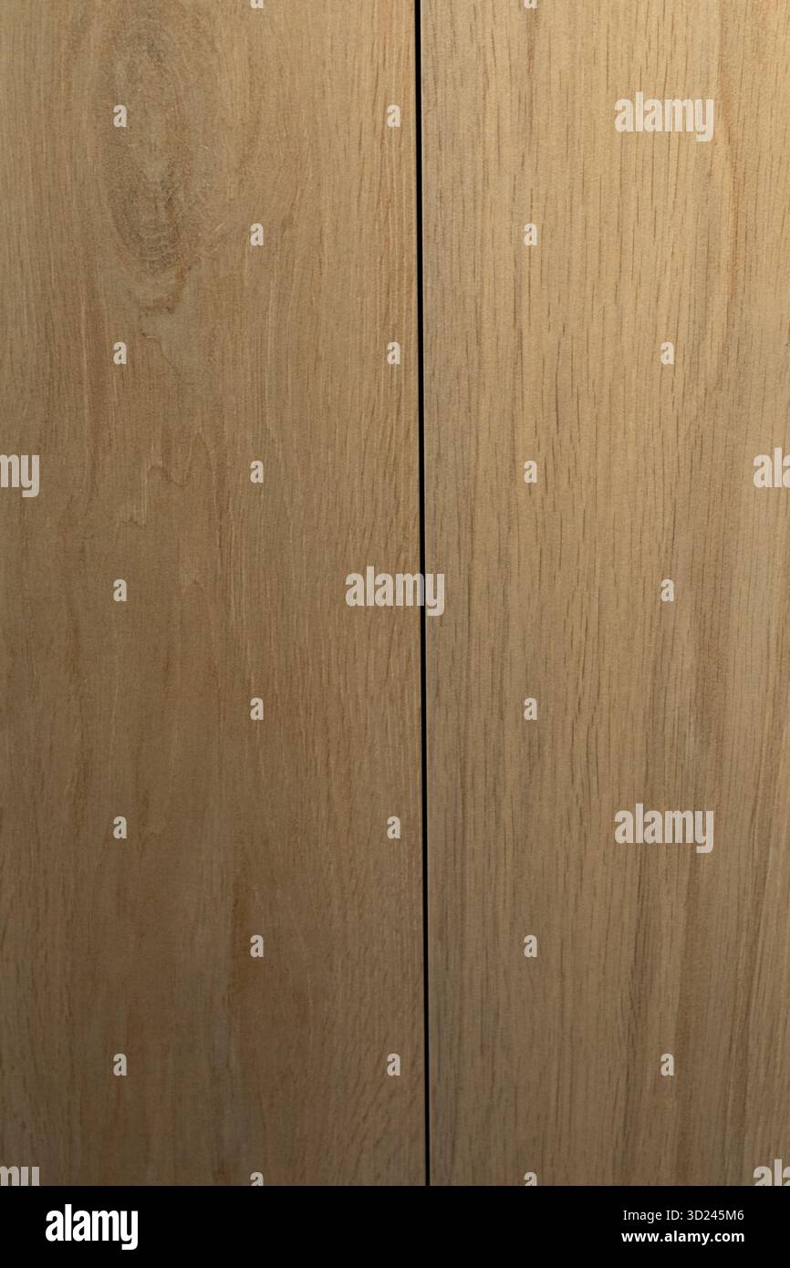Wood grain close-up showing natural texture and color variations in light brown tones Stock Photo