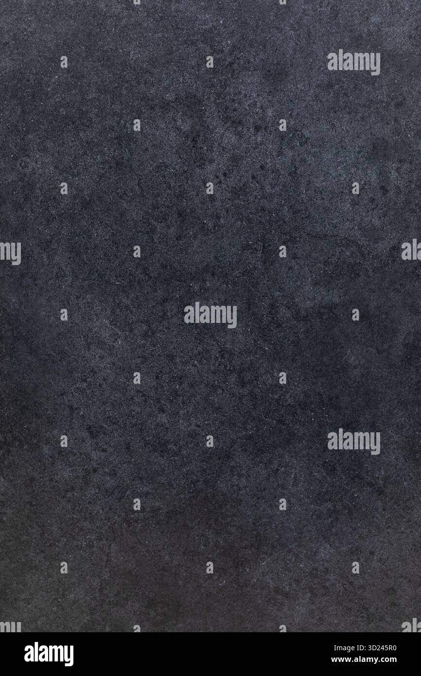 Dark textured surface showing a subtle pattern ideal for creative backgrounds and designs in various projects Stock Photo