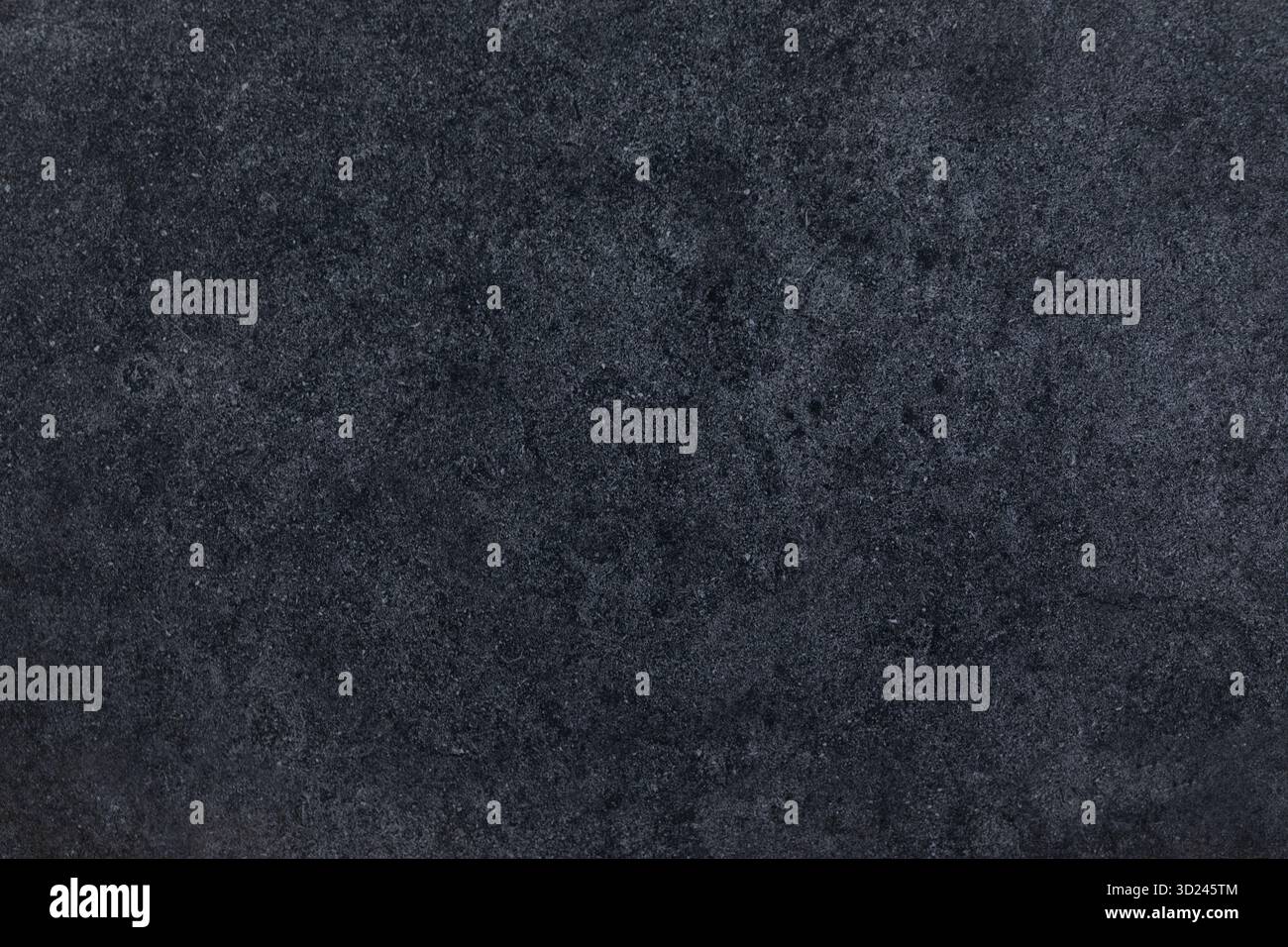 Dark textured surface with a subtle pattern creating a modern and elegant backdrop Stock Photo