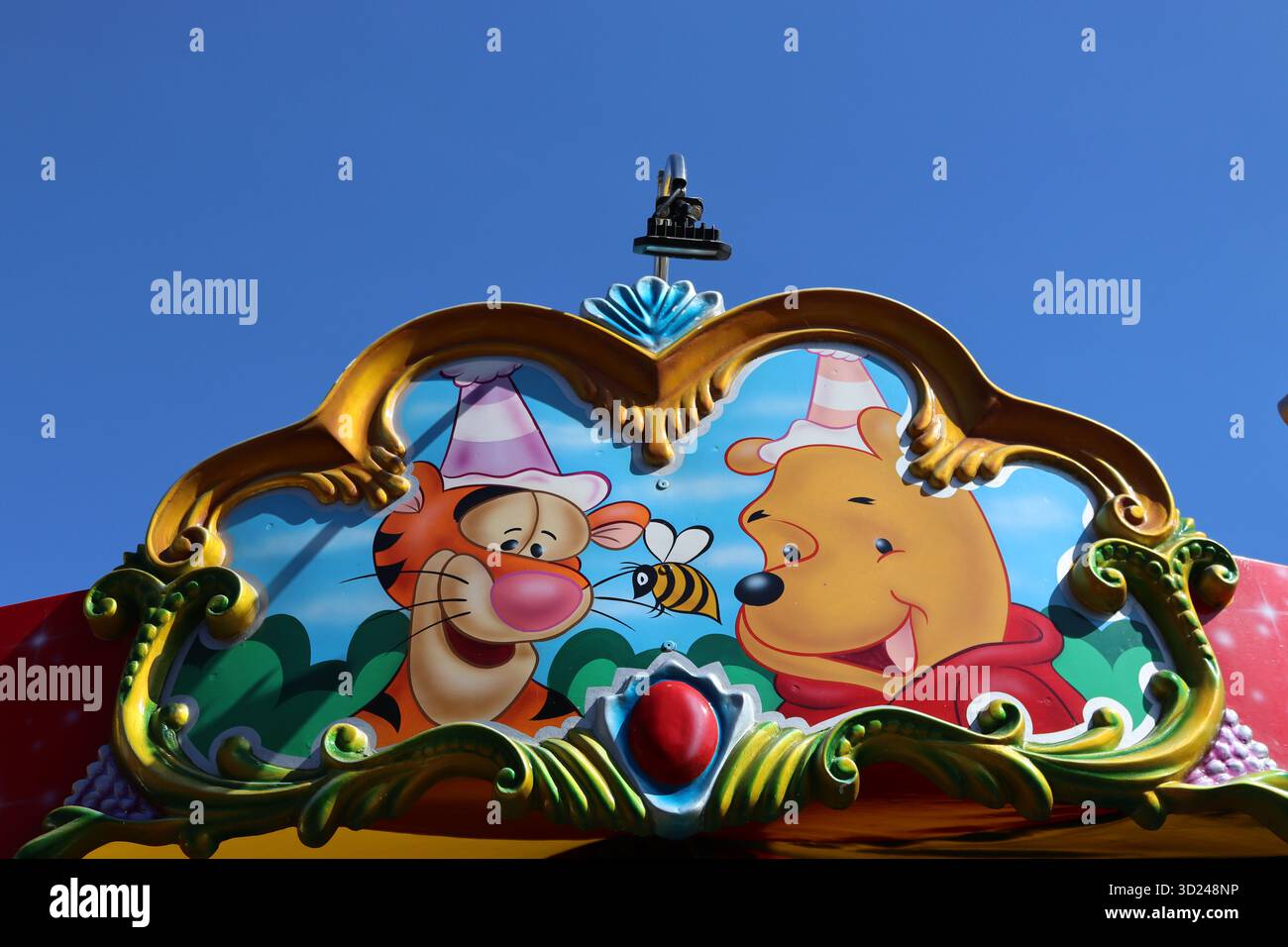 A colourful fairground ride header panel with portraits of well known ...