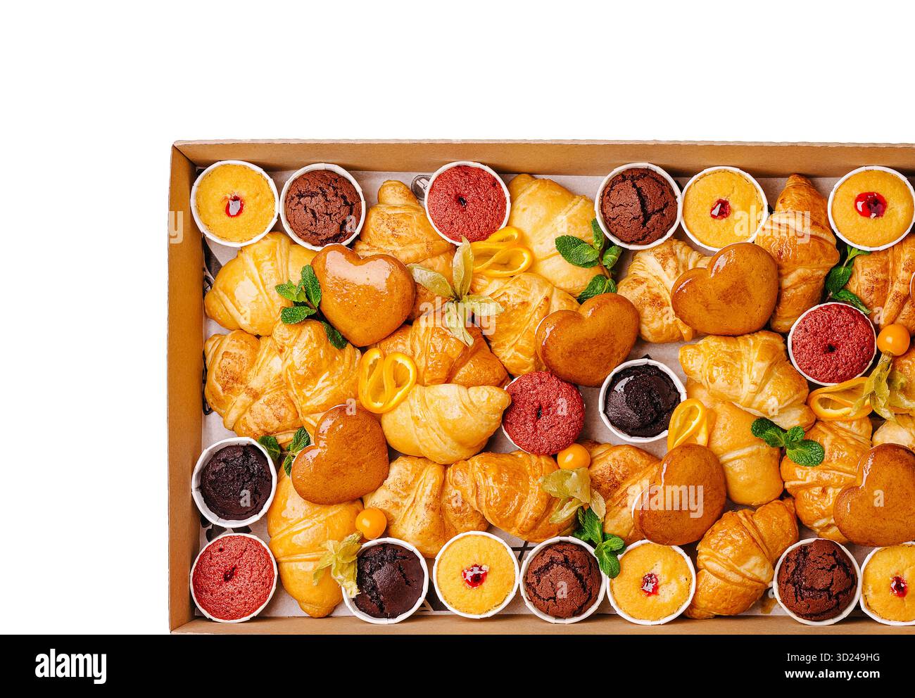 Assorted pastries and desserts displayed in a decorative box for celebrations Stock Photo