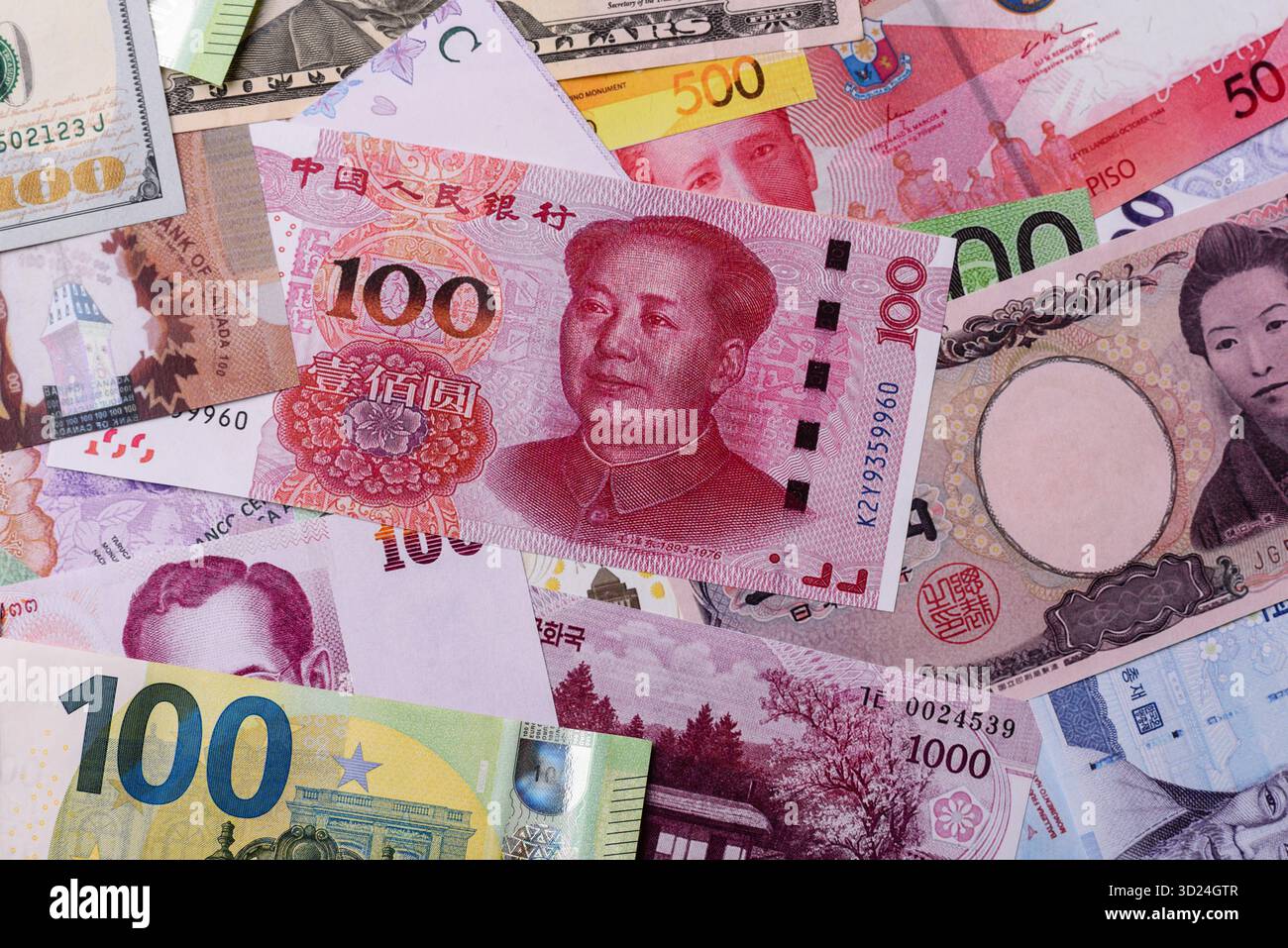 Paper money, banknotes of different countries as a business background. Paper money and cash Stock Photo