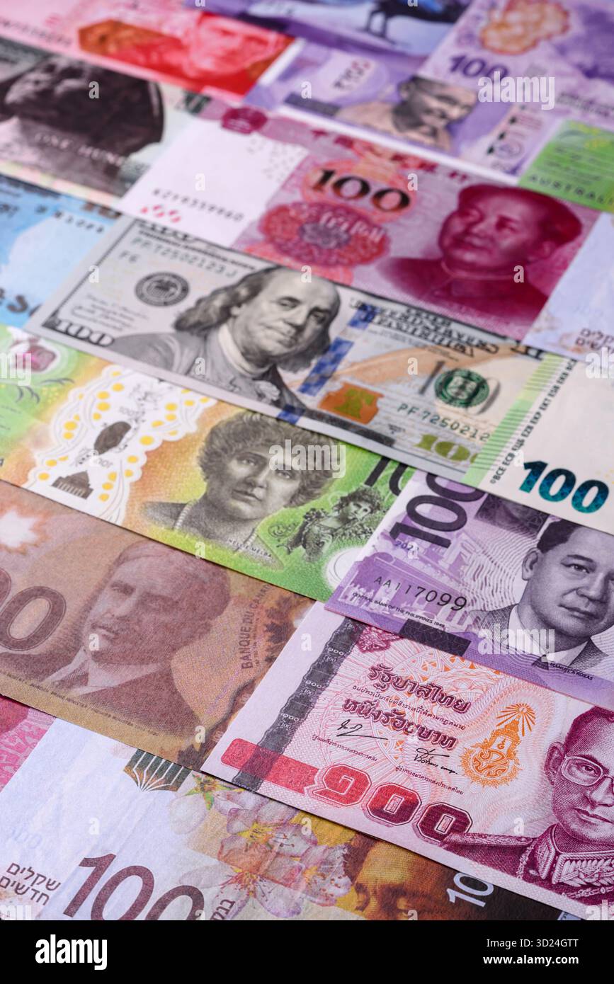 Paper money, banknotes of different countries as a business background. Paper money and cash Stock Photo