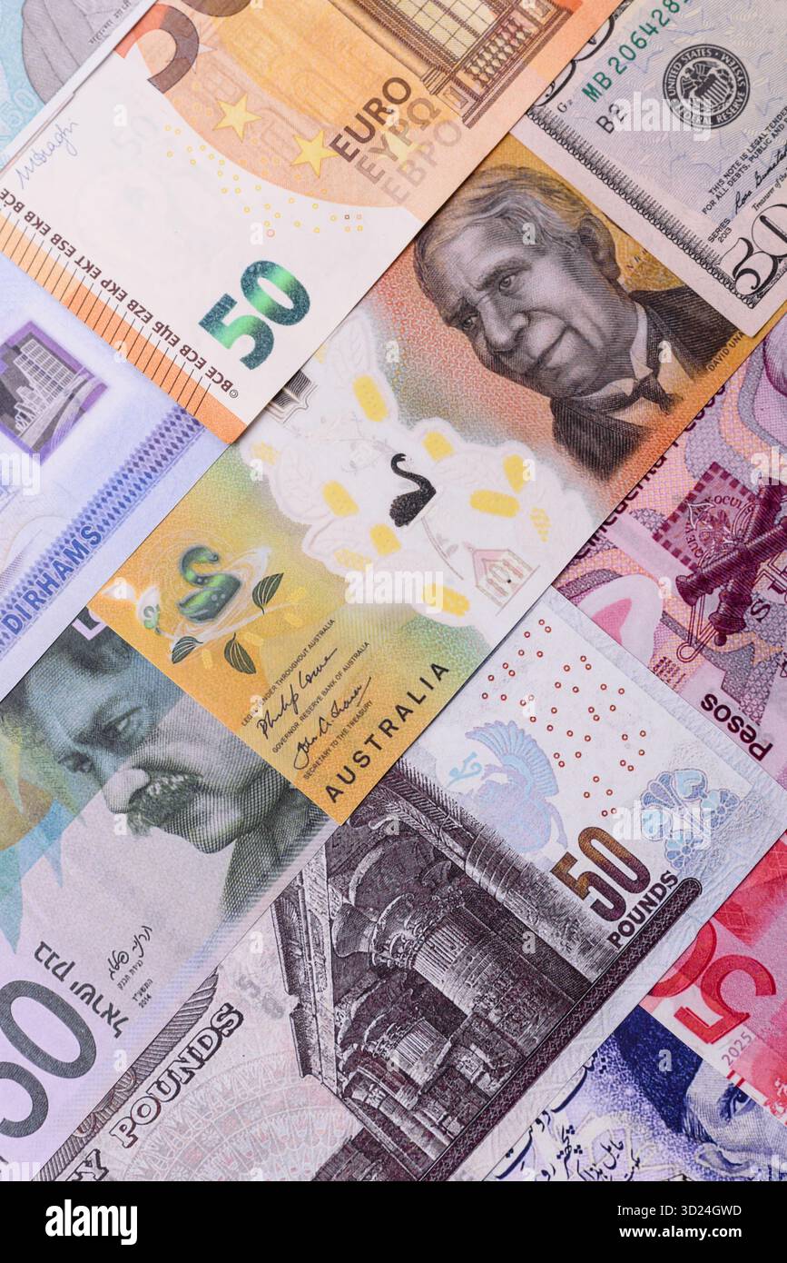 Paper money, banknotes of different countries as a business background. Paper money and cash Stock Photo
