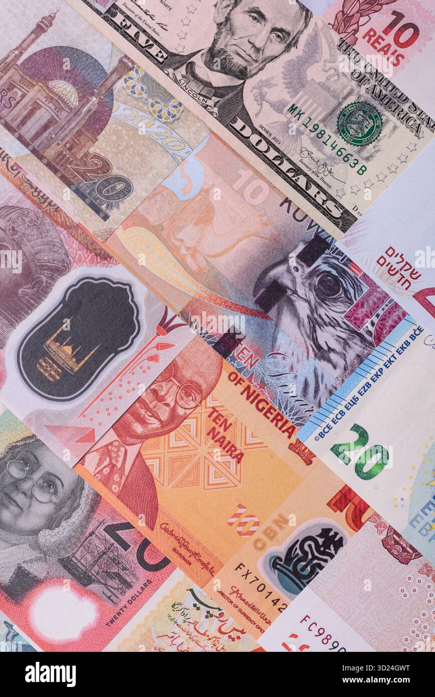 Paper money, banknotes of different countries as a business background. Paper money and cash Stock Photo
