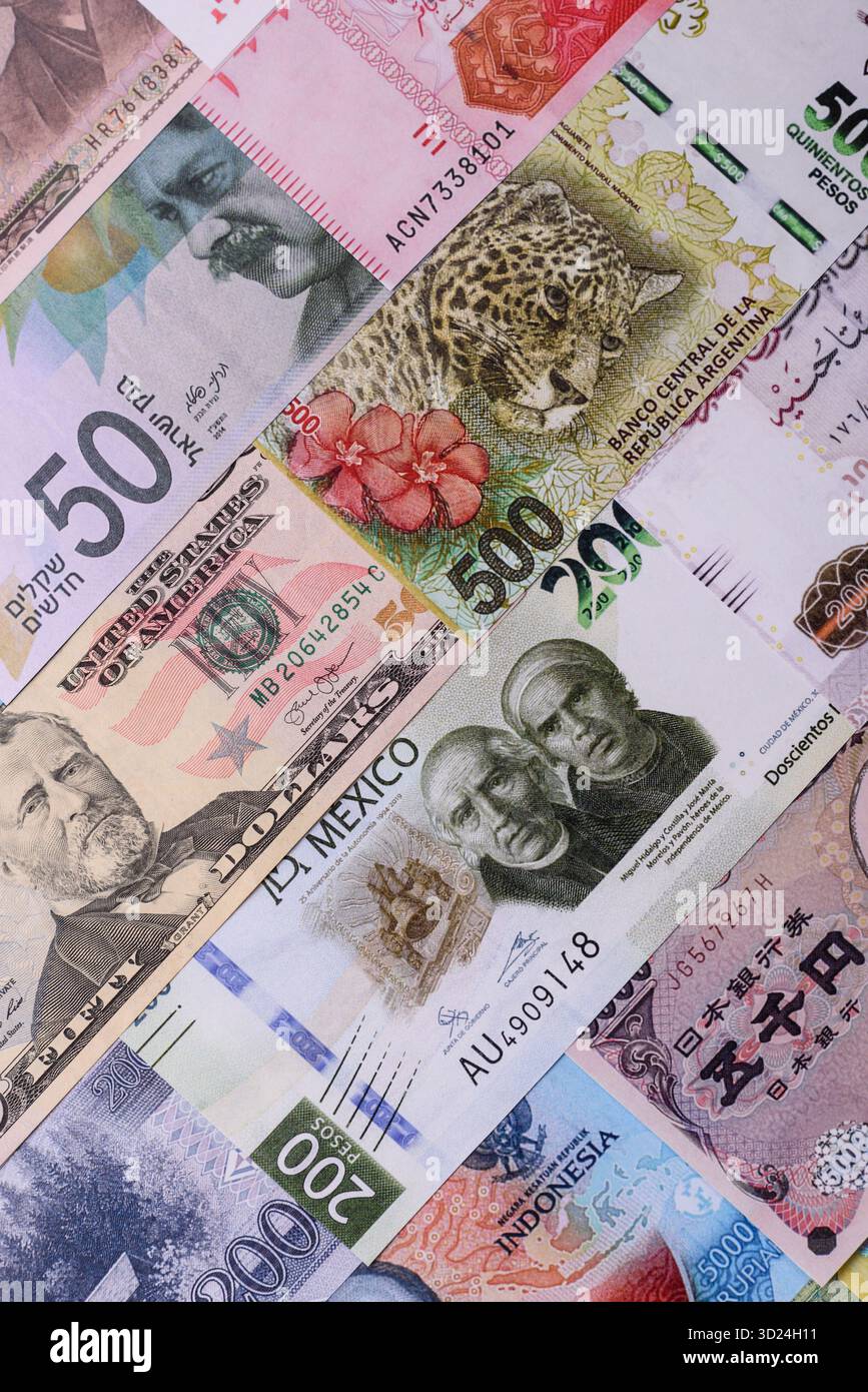 Paper money, banknotes of different countries as a business background. Paper money and cash Stock Photo
